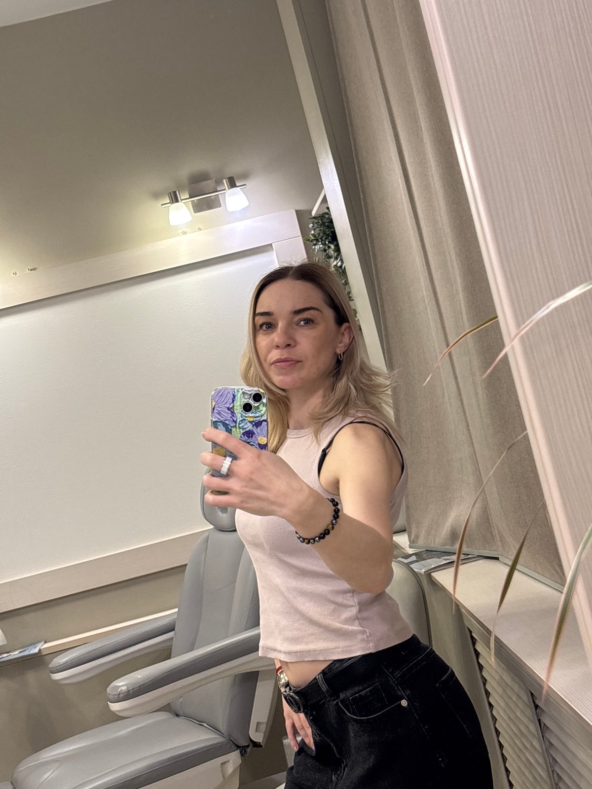Woman takes selfies in dental clinic in Vsevolozhsk