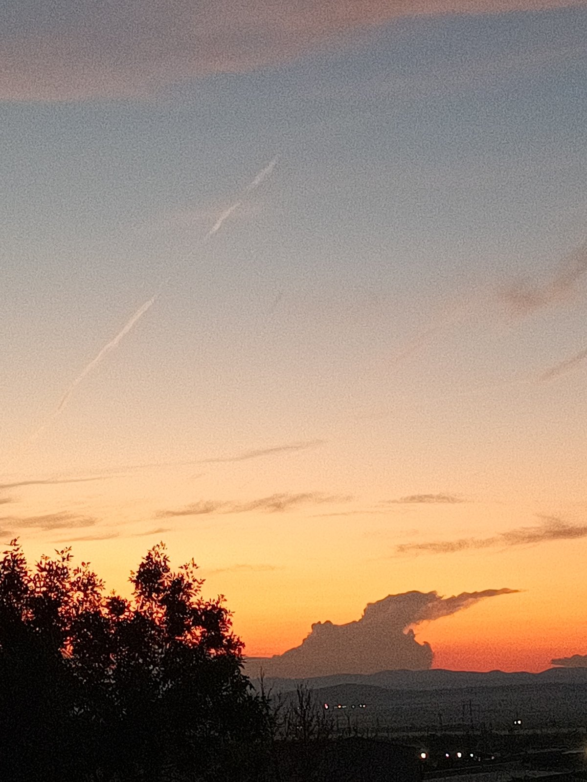 Witnesses document sunset sequence over semi-urban landscape June 8