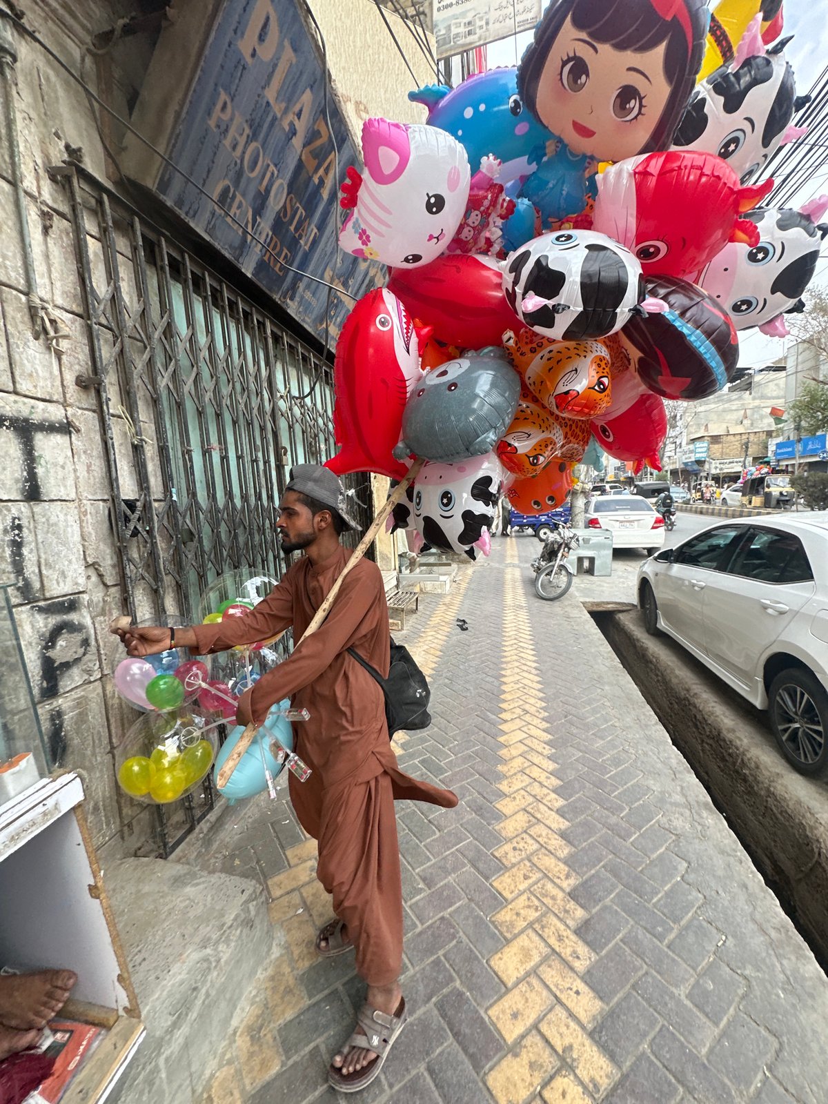 Balloon vendor selling colorful balloons on the streets of Quetta
