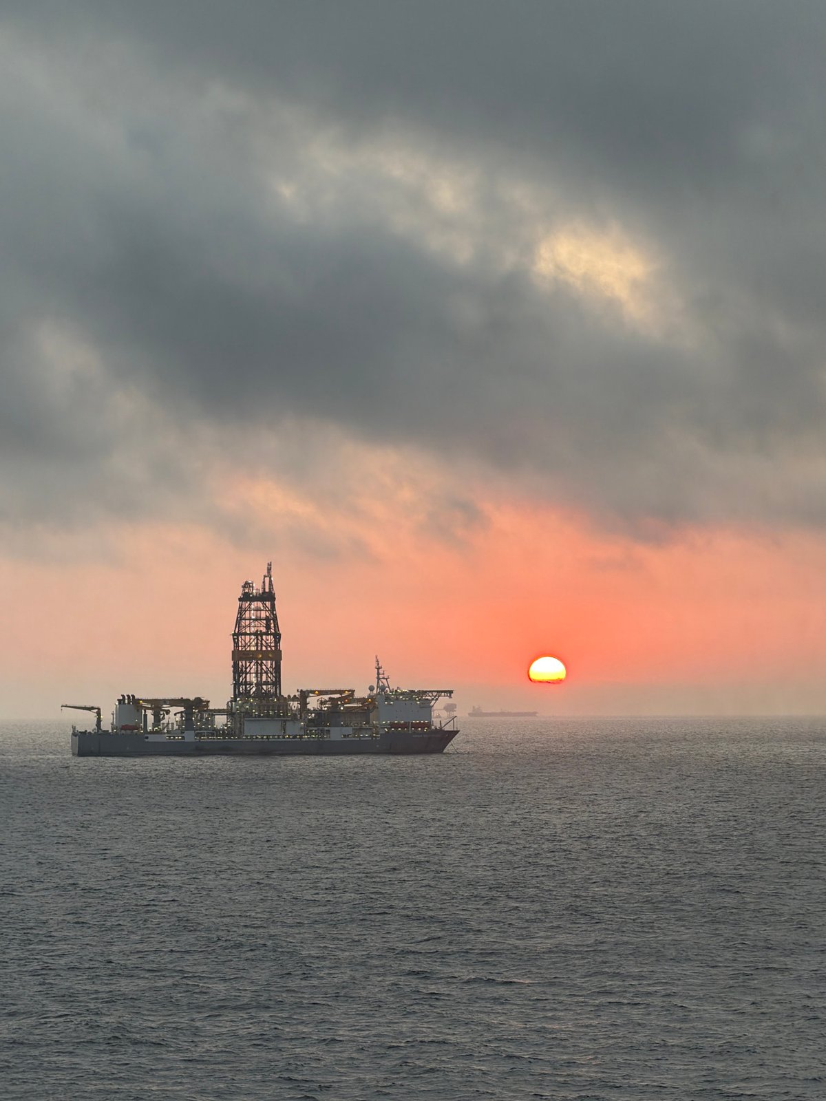 Offshore oil rigs observed during dramatic sunrise in Gulf