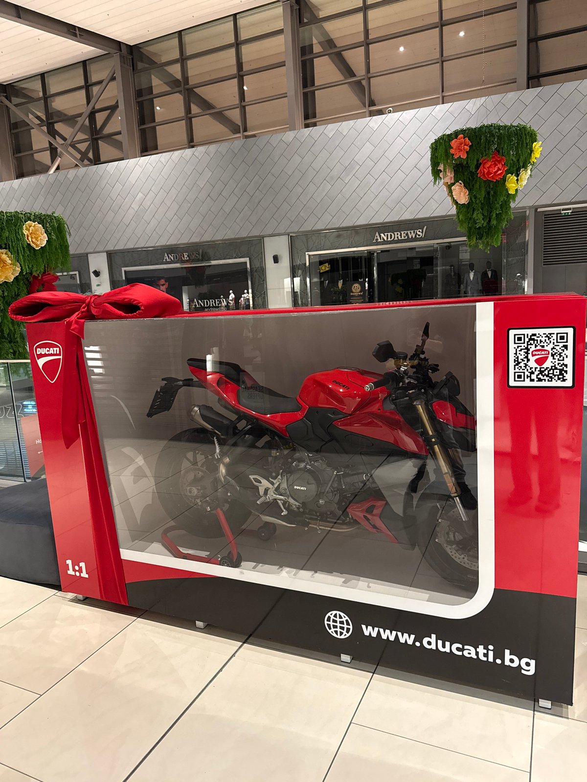Ducati motorcycle showcased in glass display at Sofia mall