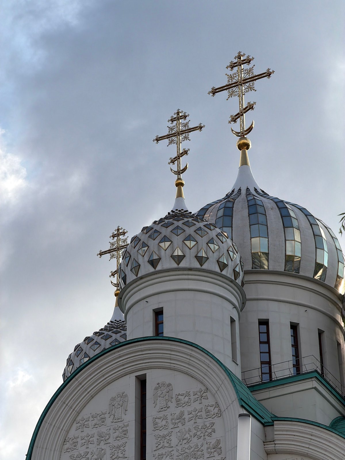 Orthodox church domes rise against a cloudy Moscow sky