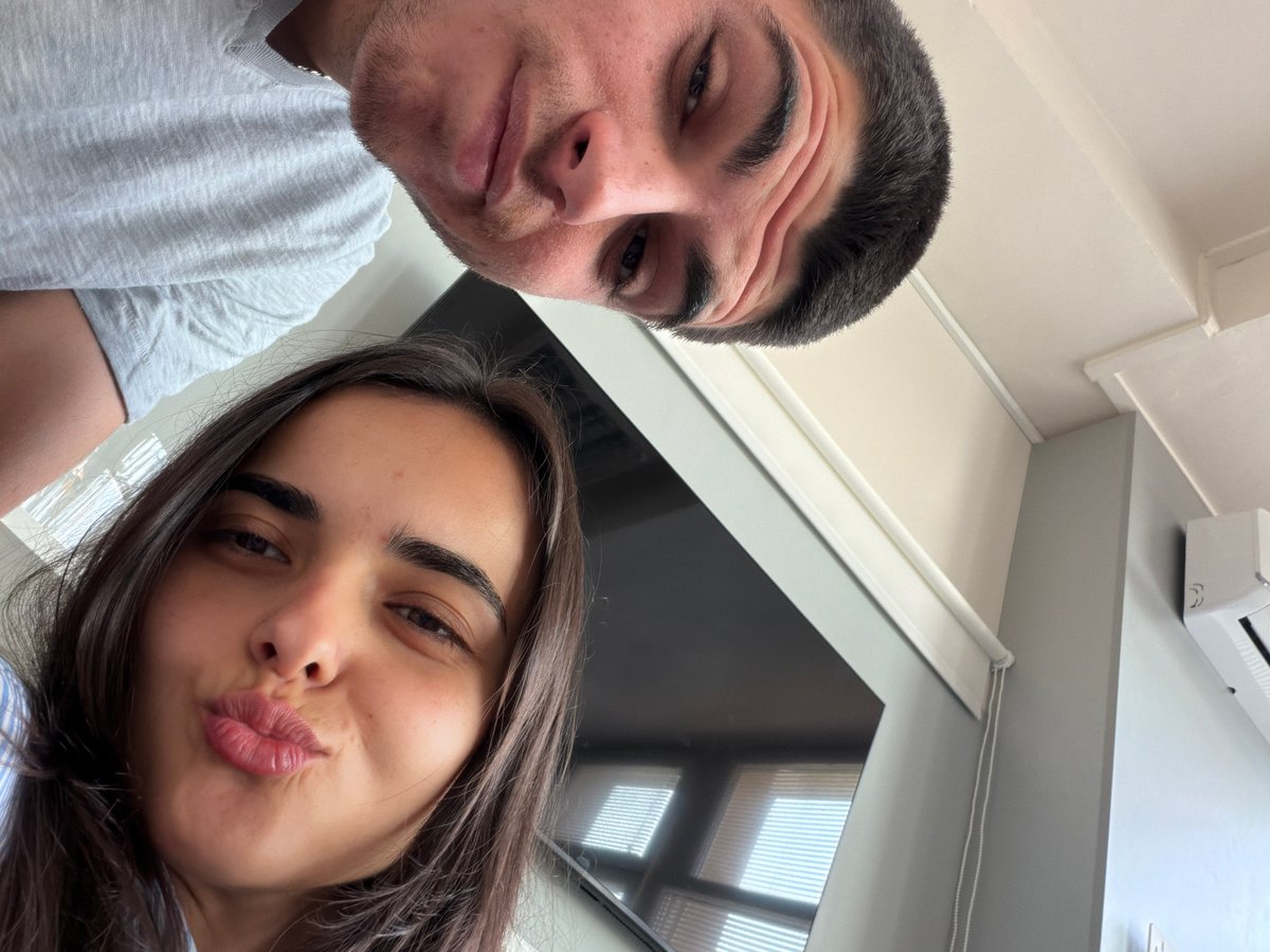 Two people photographed together in Sofia living space