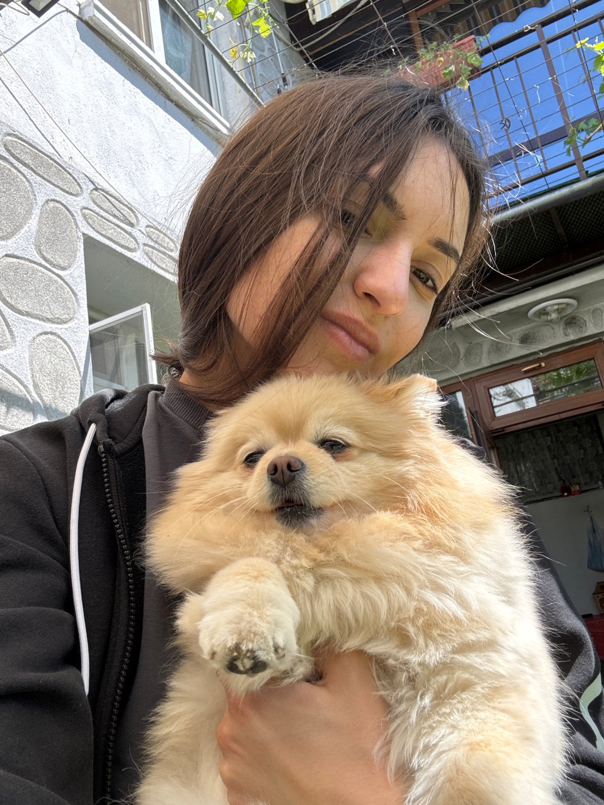 Woman with dog photographed in Razlog, Bulgaria