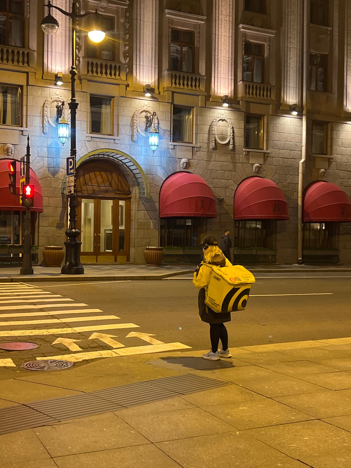 Delivery worker makes evening rounds in Saint Petersburg