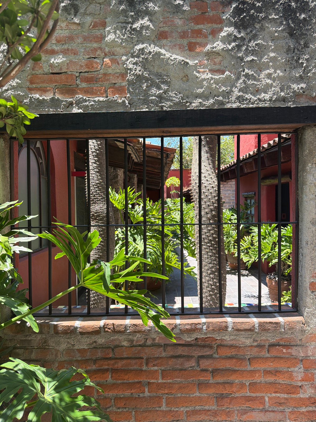 Person documents architecture, takes selfie during Puebla visit