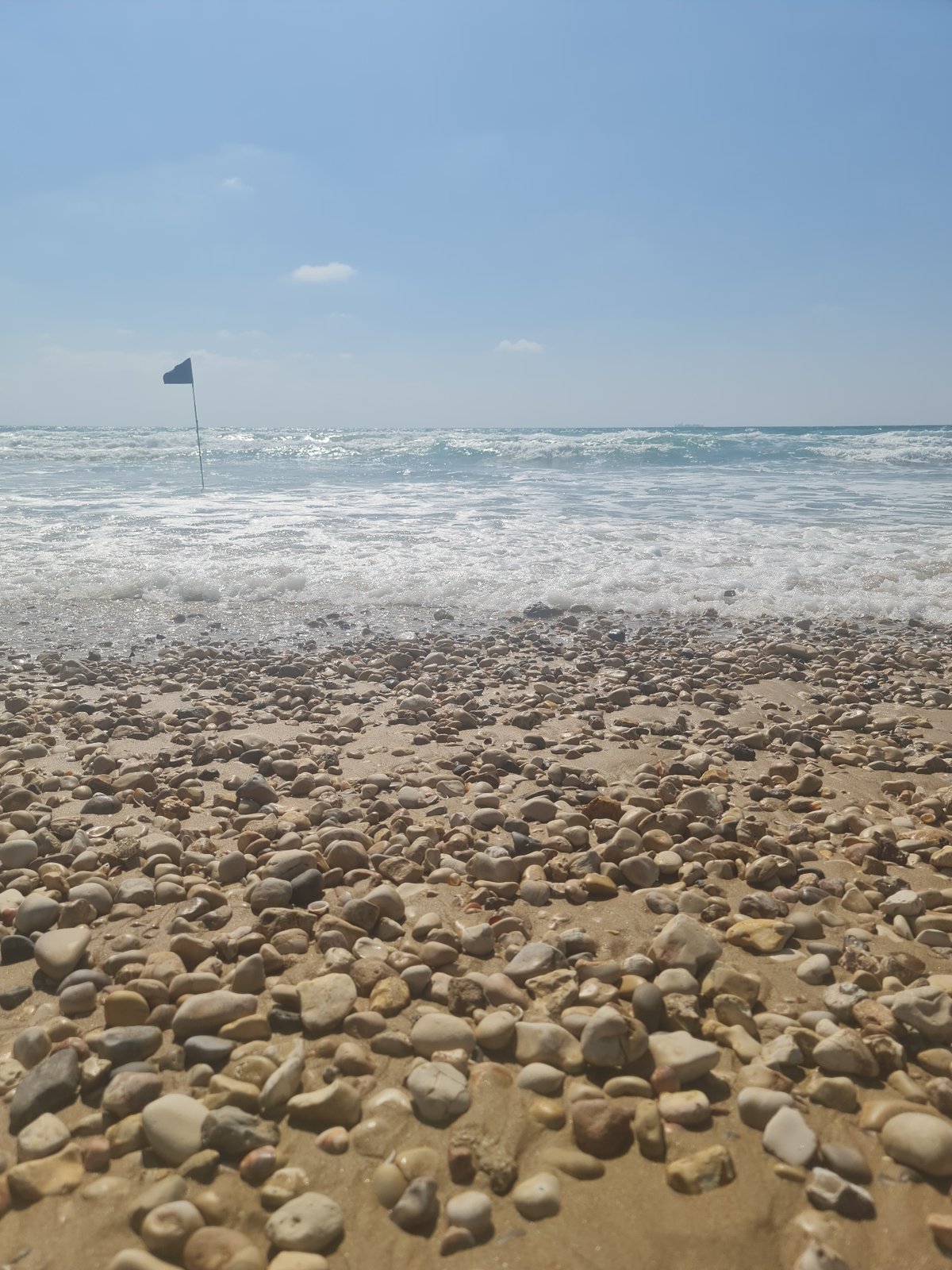 Beach scenes with sand messages and Israeli flags