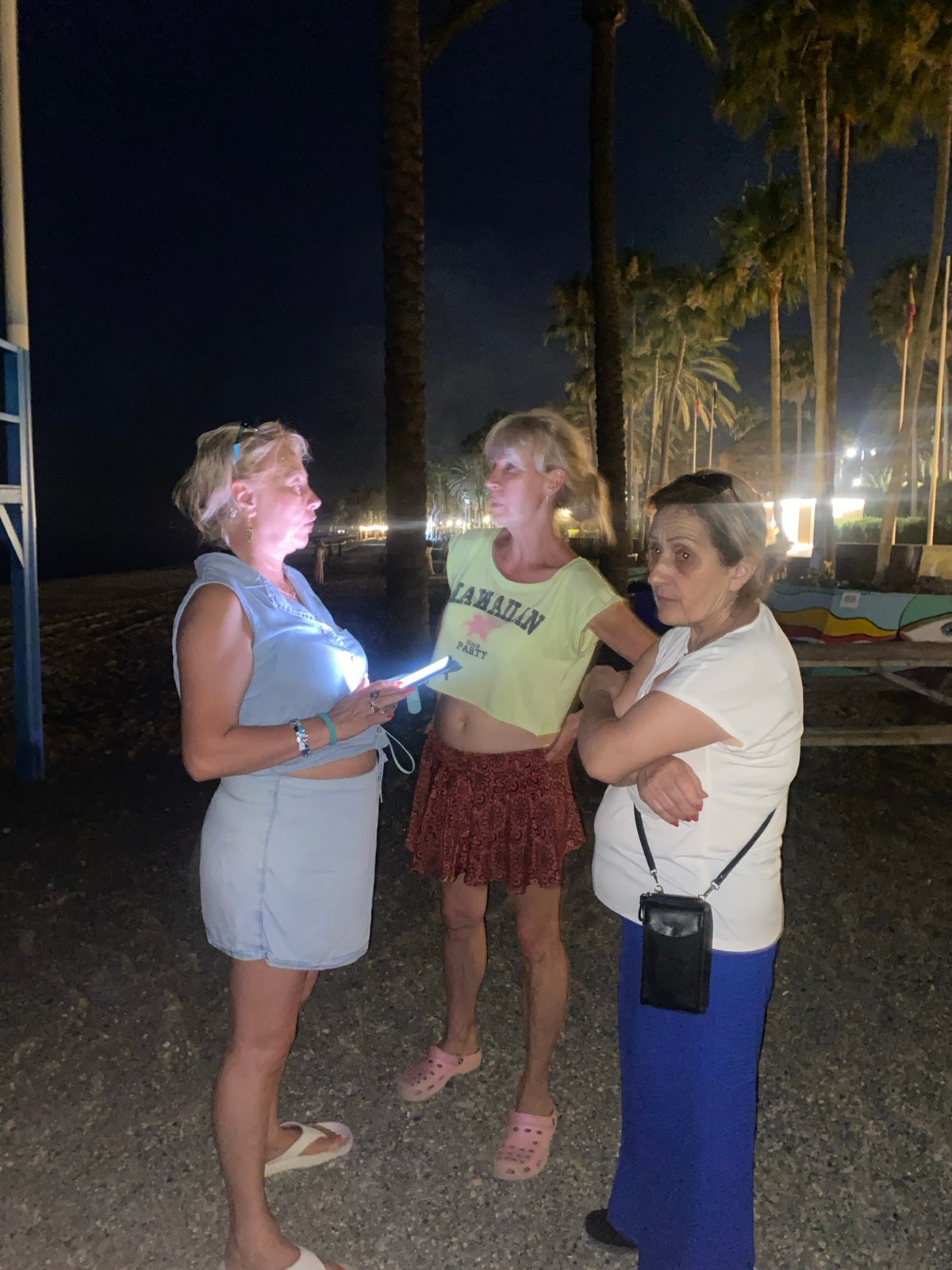 Late-night beach barbecue under a full moon in Marbella