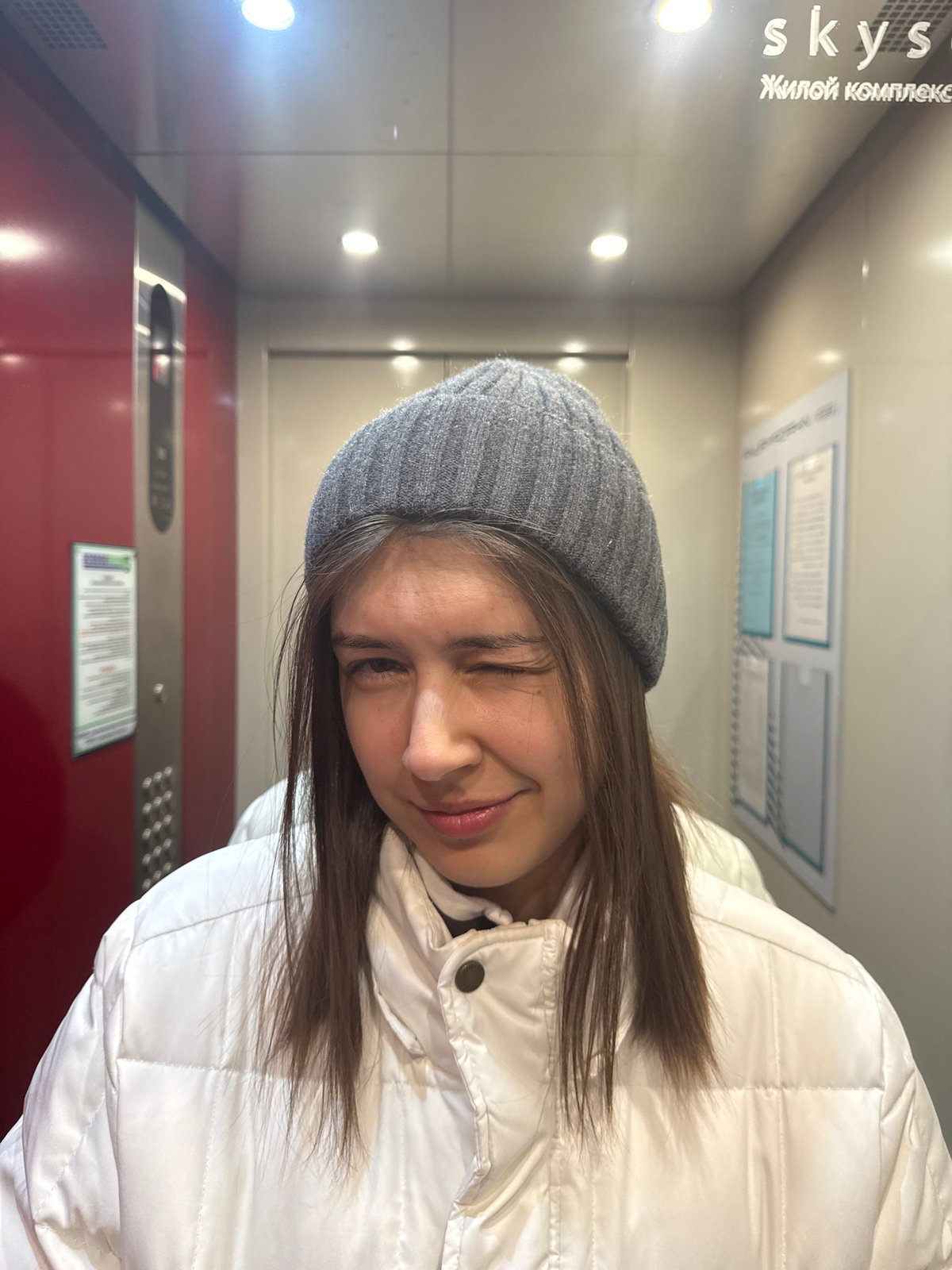 Woman takes elevator selfies, dog walks snowy streets in Krasnoyarsk
