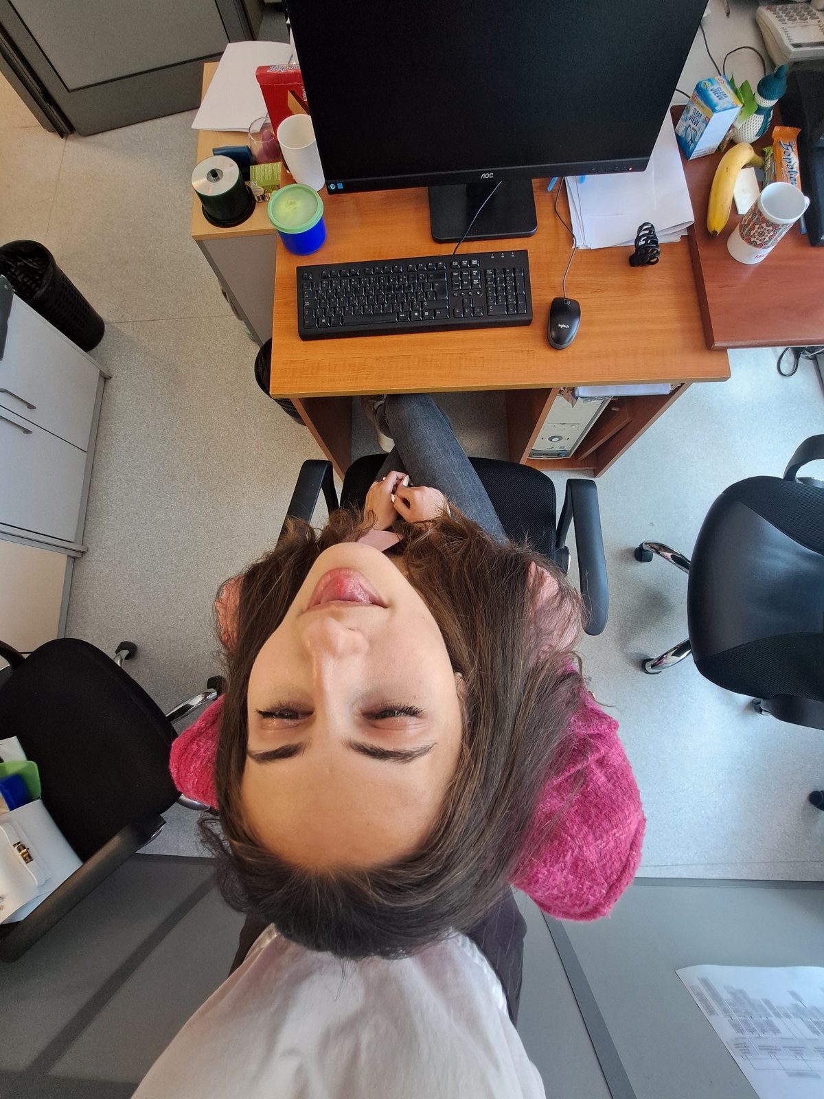 Young women photographed in casual office setting during morning hours