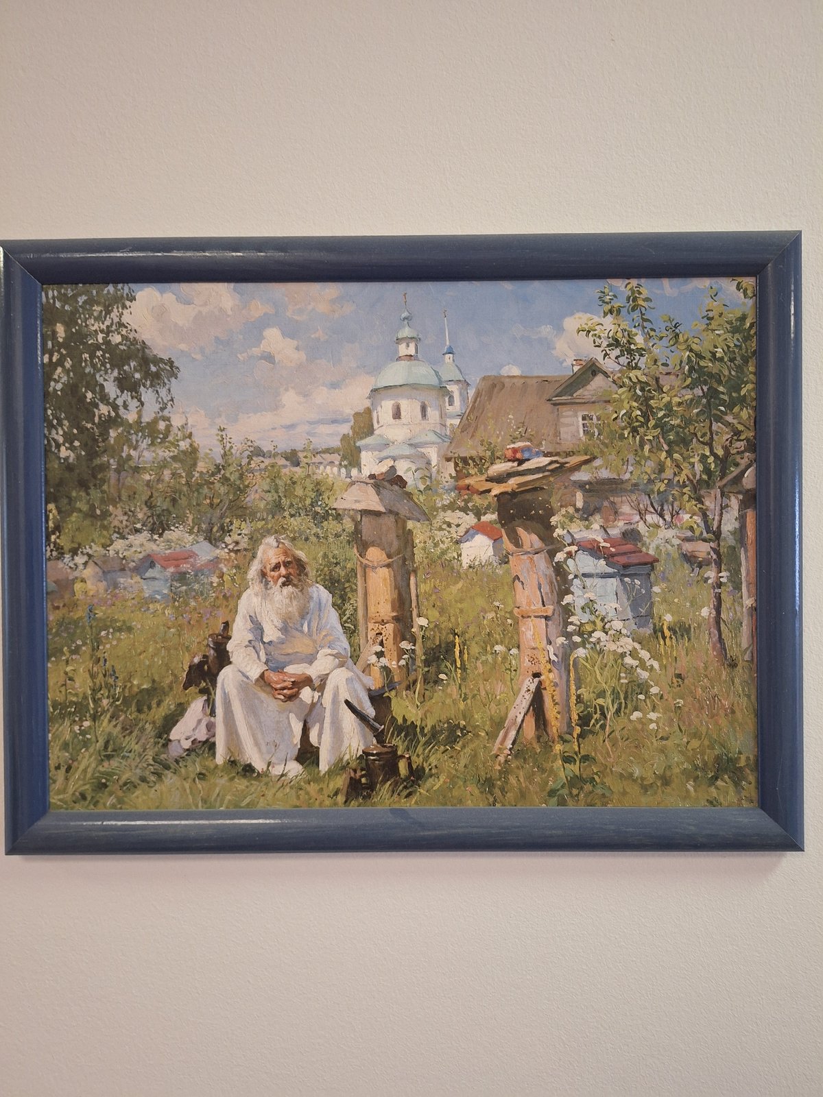 Two paintings displayed in Moscow featuring rural and winter scenes