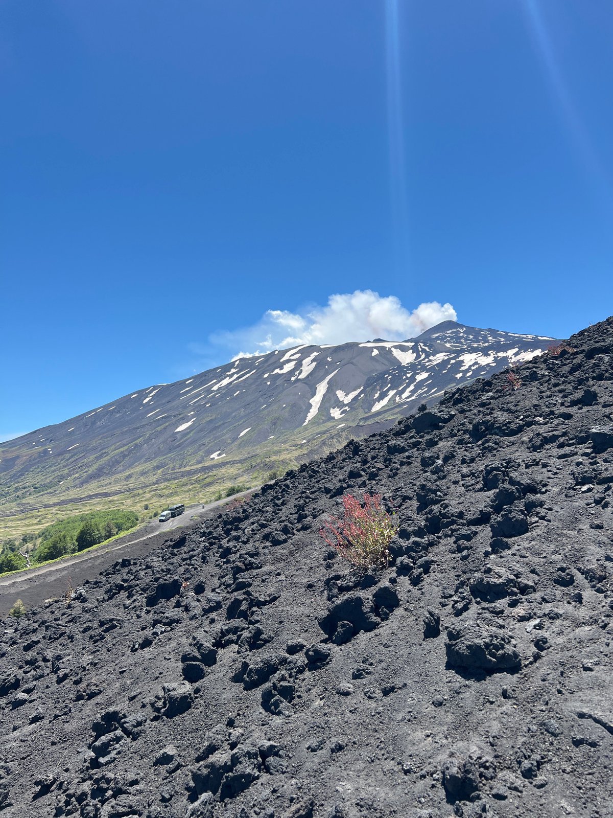 Hikers explore Mount Etna's active volcanic landscape in Sicily