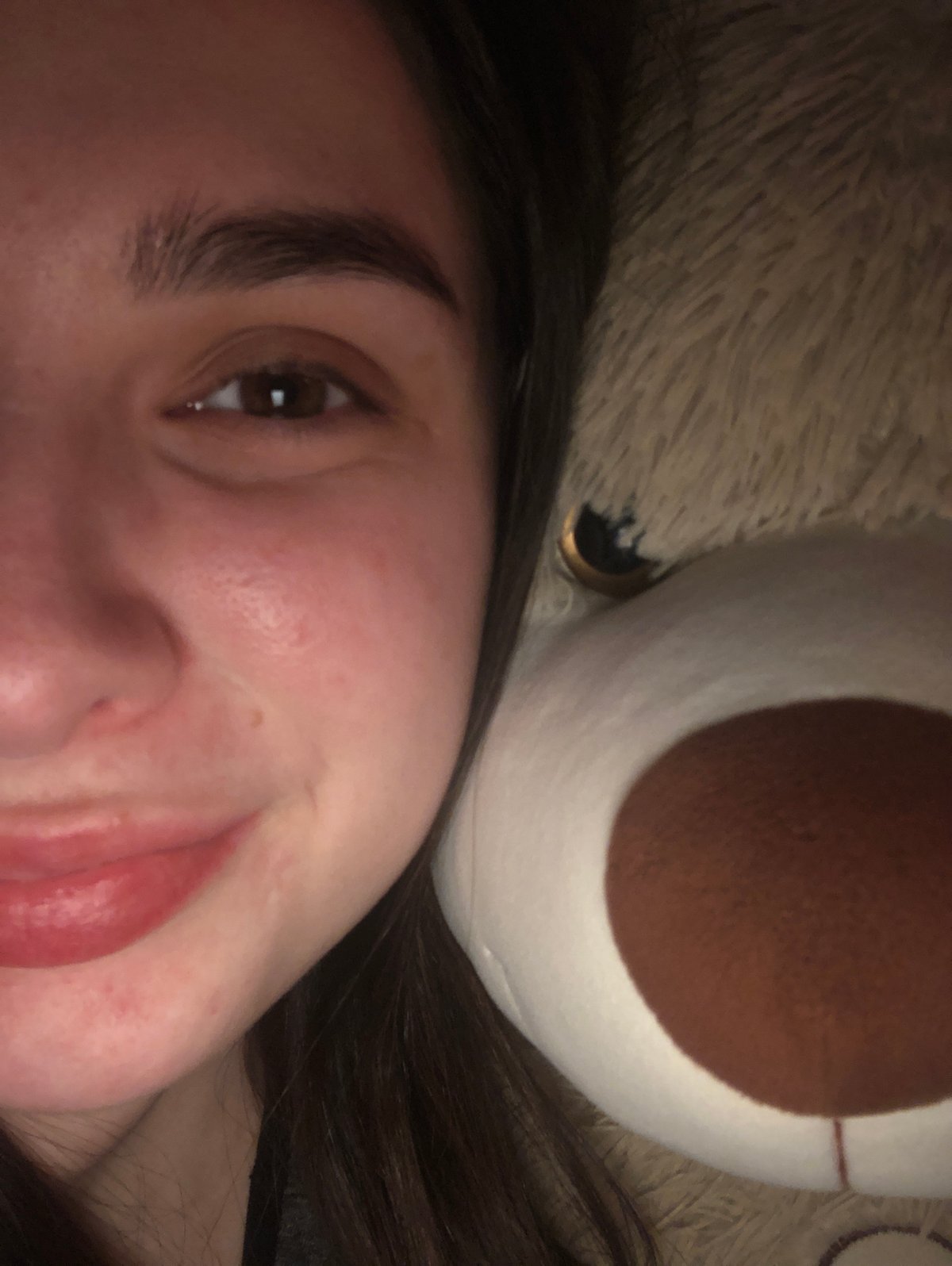 Woman poses with stuffed bunny, heart cream decoration in Russia