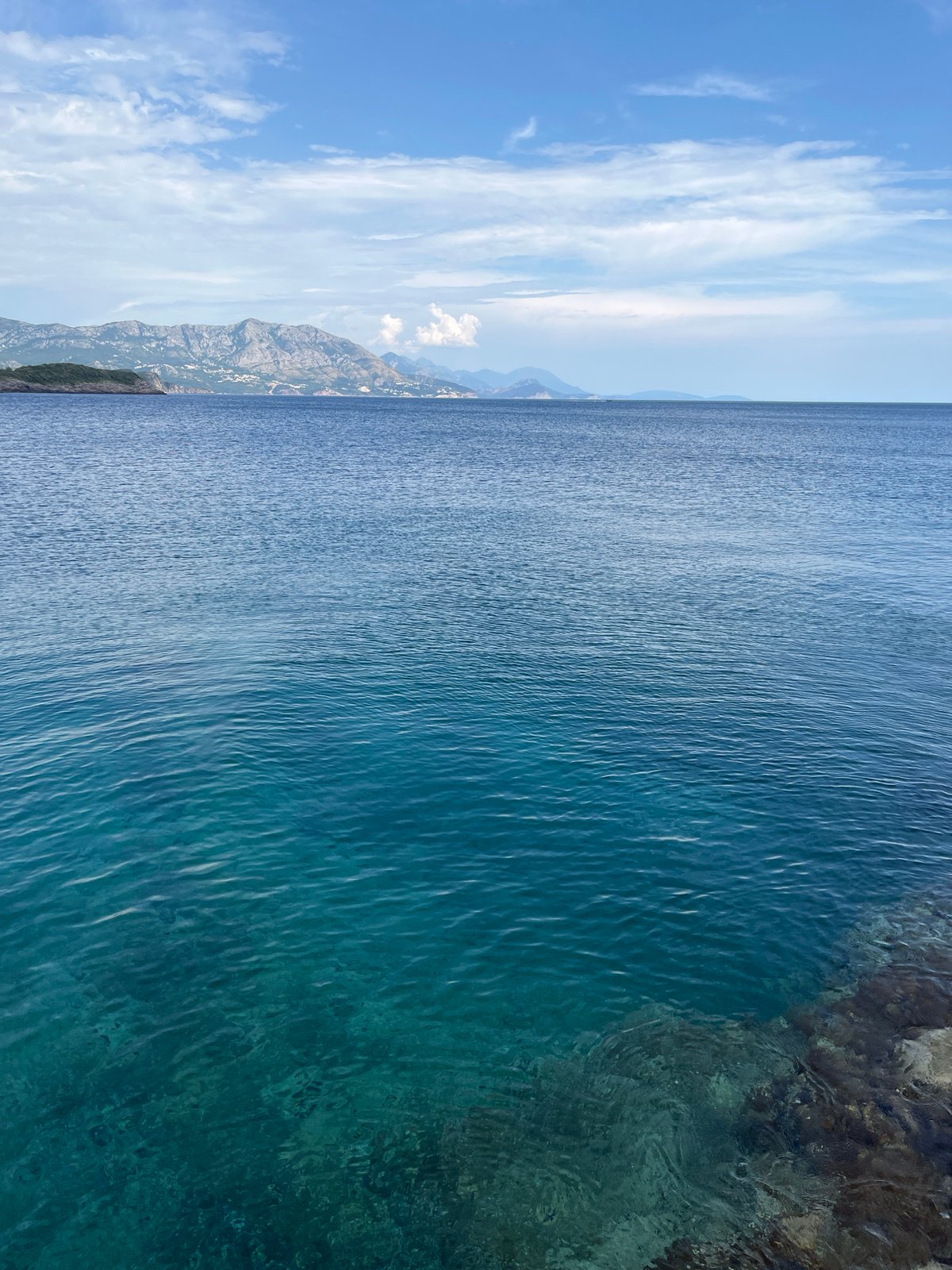 Rocky Adriatic cove near Dubraljevina, sailboat anchored offshore