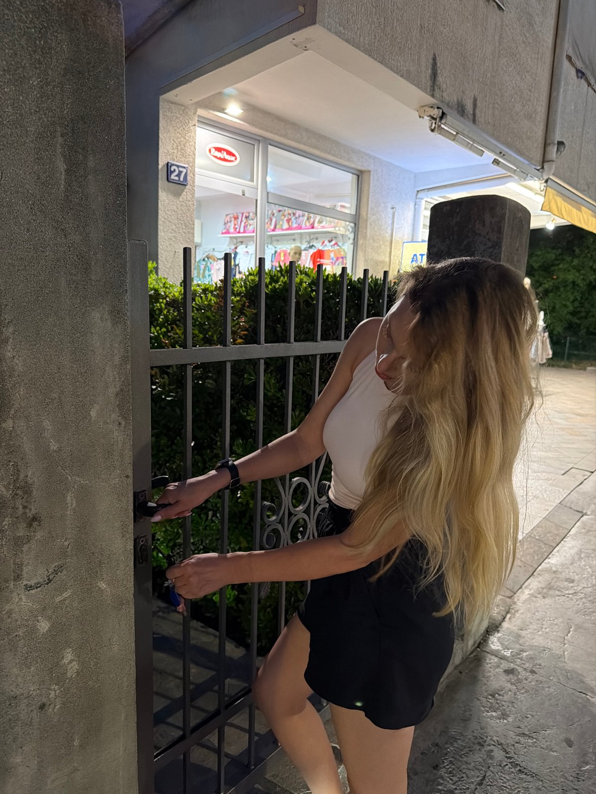Woman's evening activities documented across Budva Montenegro tourist areas