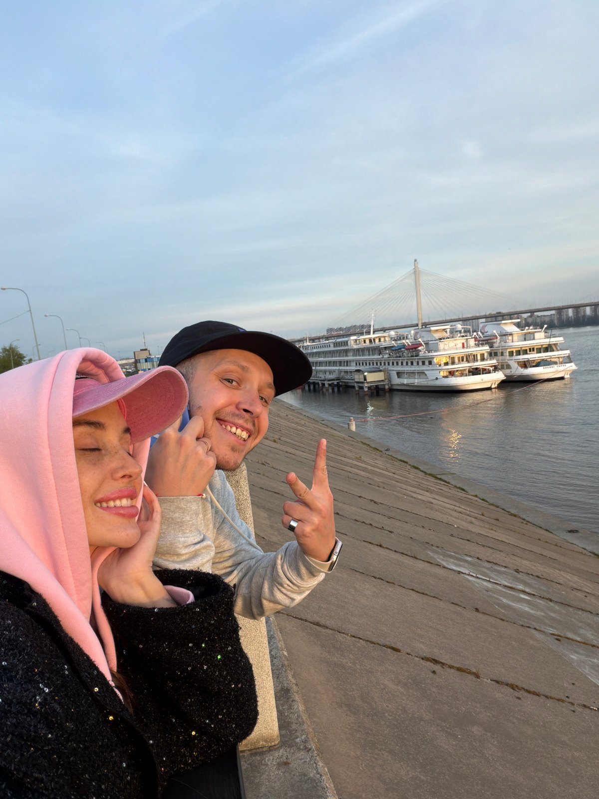 Couple enjoys sunset moments along Saint Petersburg's Neva River waterfront