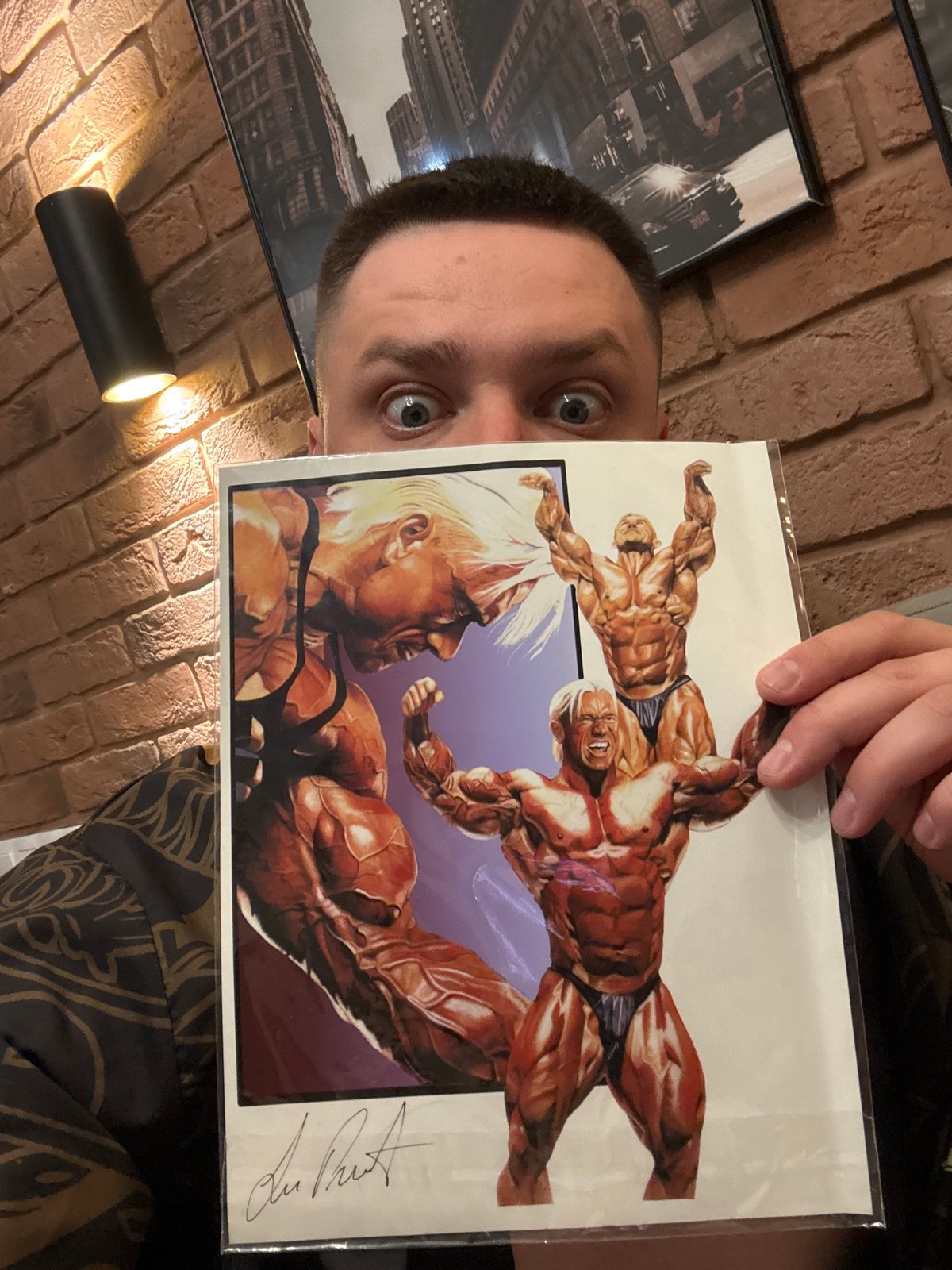 Man displays wrestling comic, workout graphics observed in Vladivostok