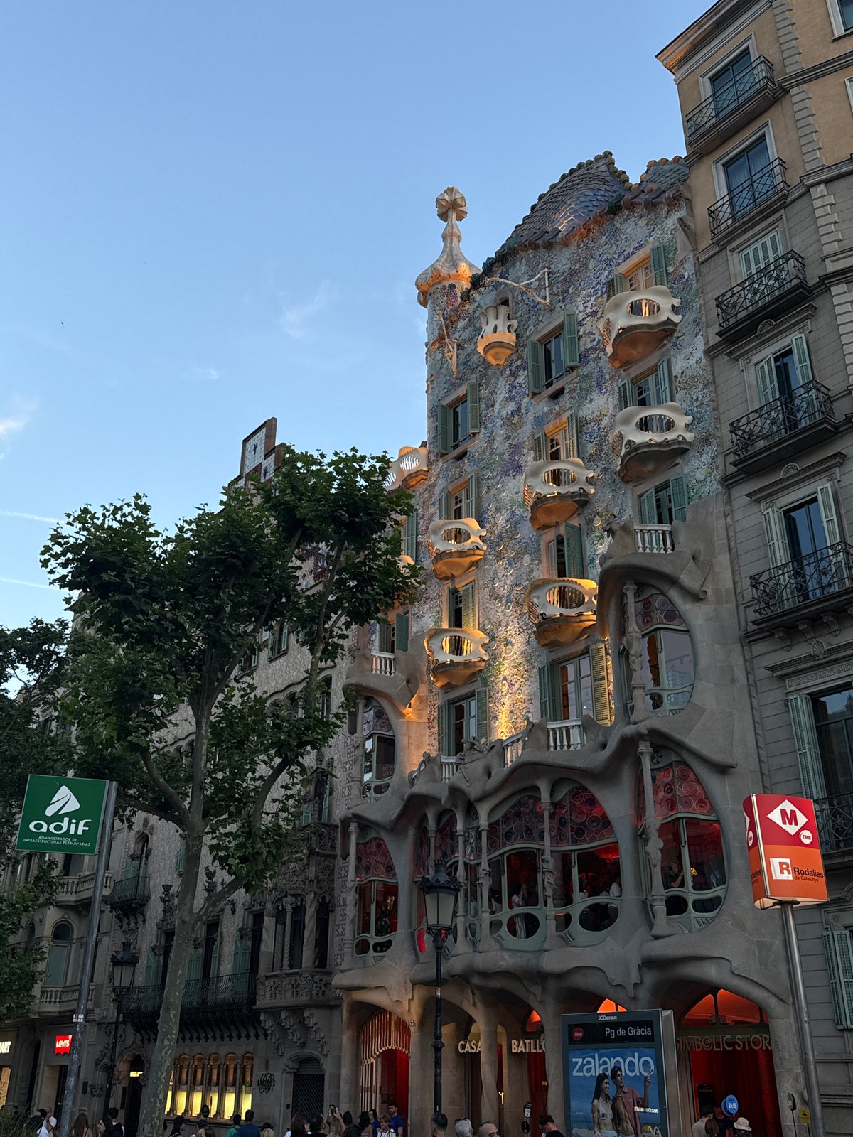 Crowds gather along Barcelona's Passeig de Gràcia near landmarks