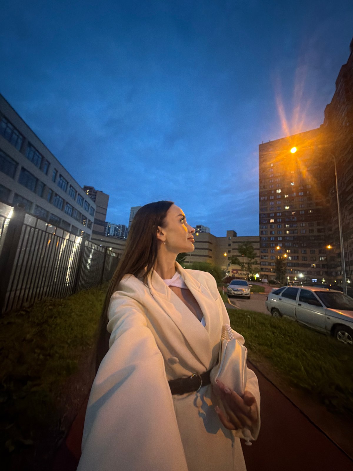 Dusk fashion shoot near Saint Petersburg building complex