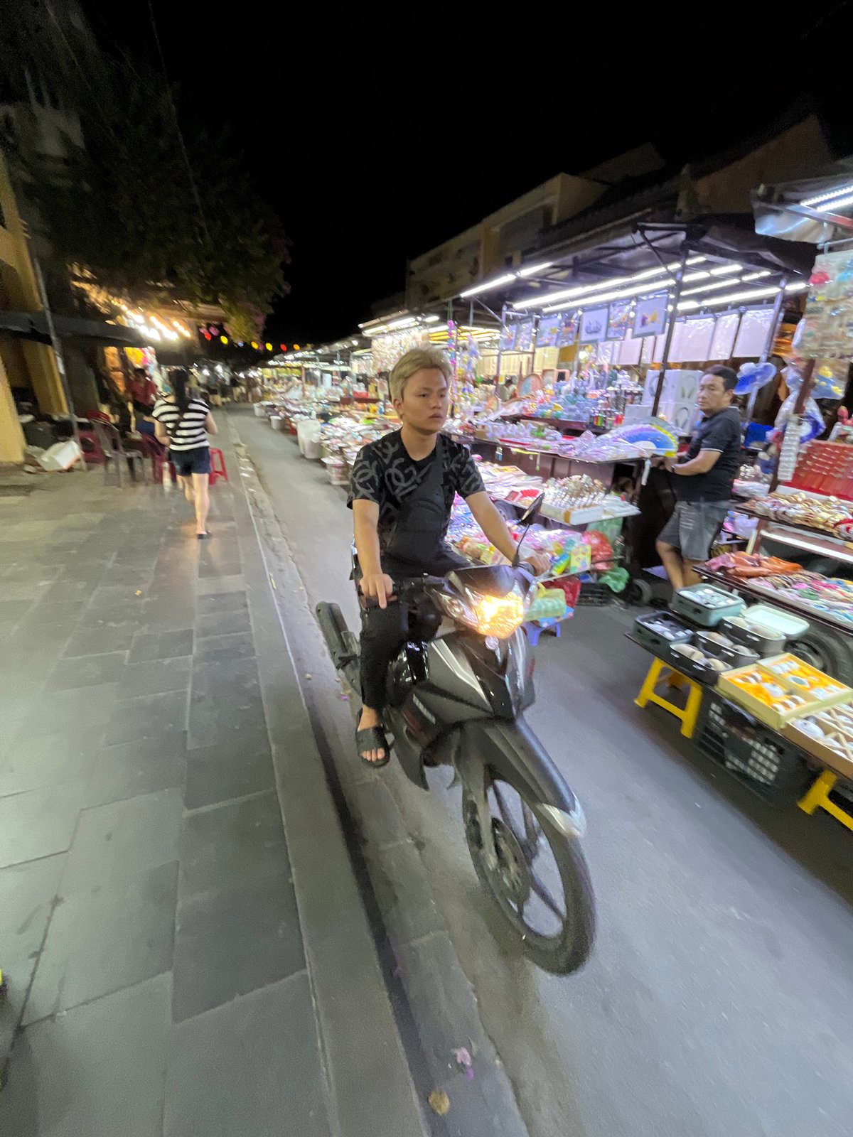 Evening street life documented in historic Hội An tourist district