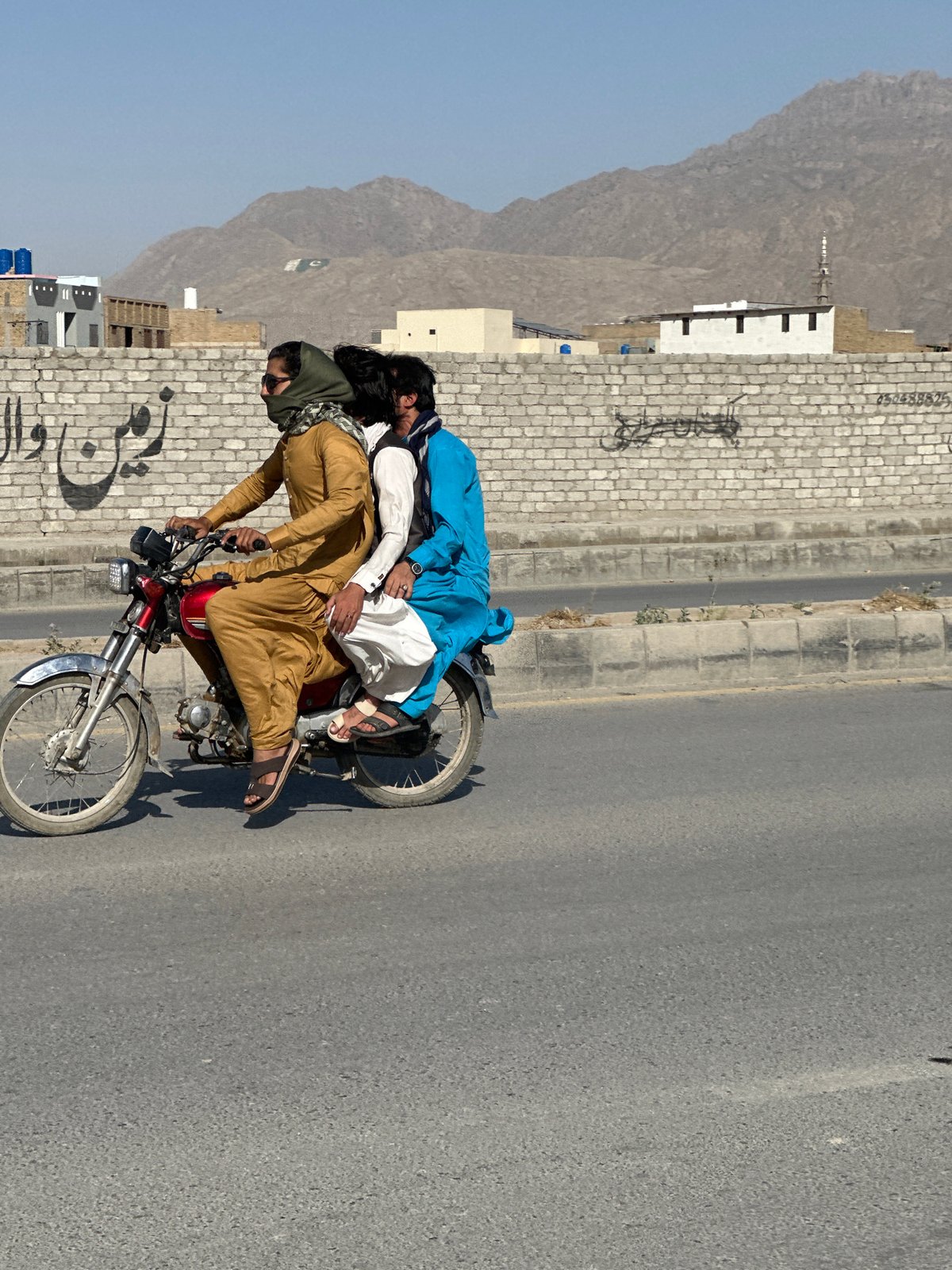 Three people spotted on red motorcycle in Quetta