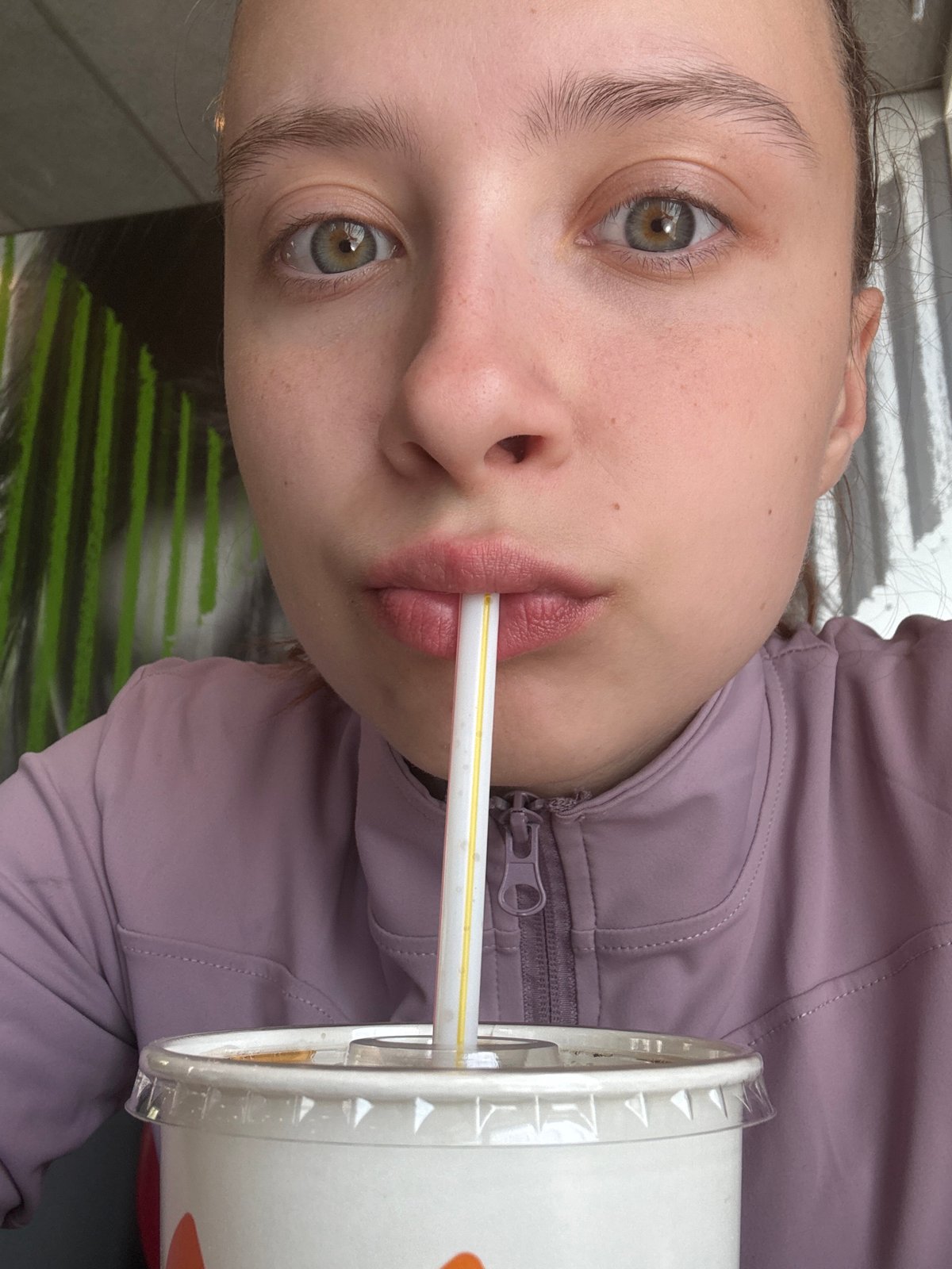 Young woman enjoys McDonald's meal in Perm, Russia