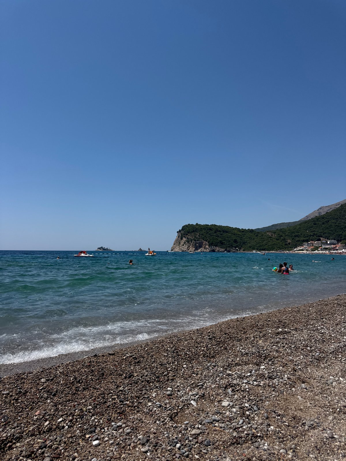Lazy summer afternoon on a pebble beach in Montenegro