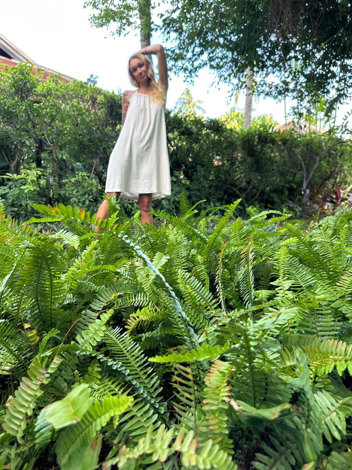 Tourist enjoys morning at Vietnamese resort garden