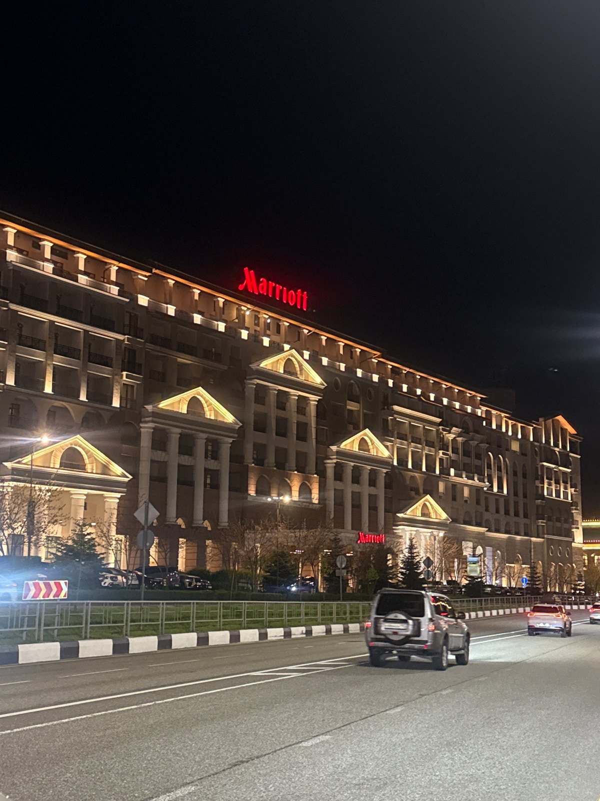 Ornate classical building photographed at night in Estosadok, Russia