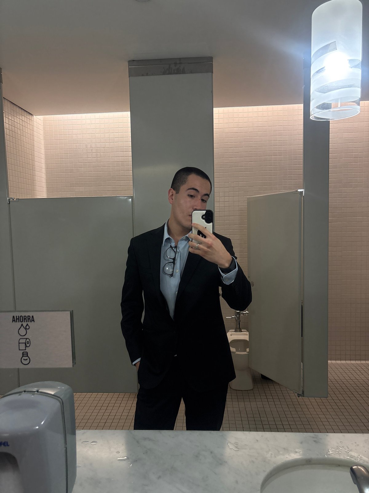 Person Takes Mirror Selfie in Mexico City Public Restroom