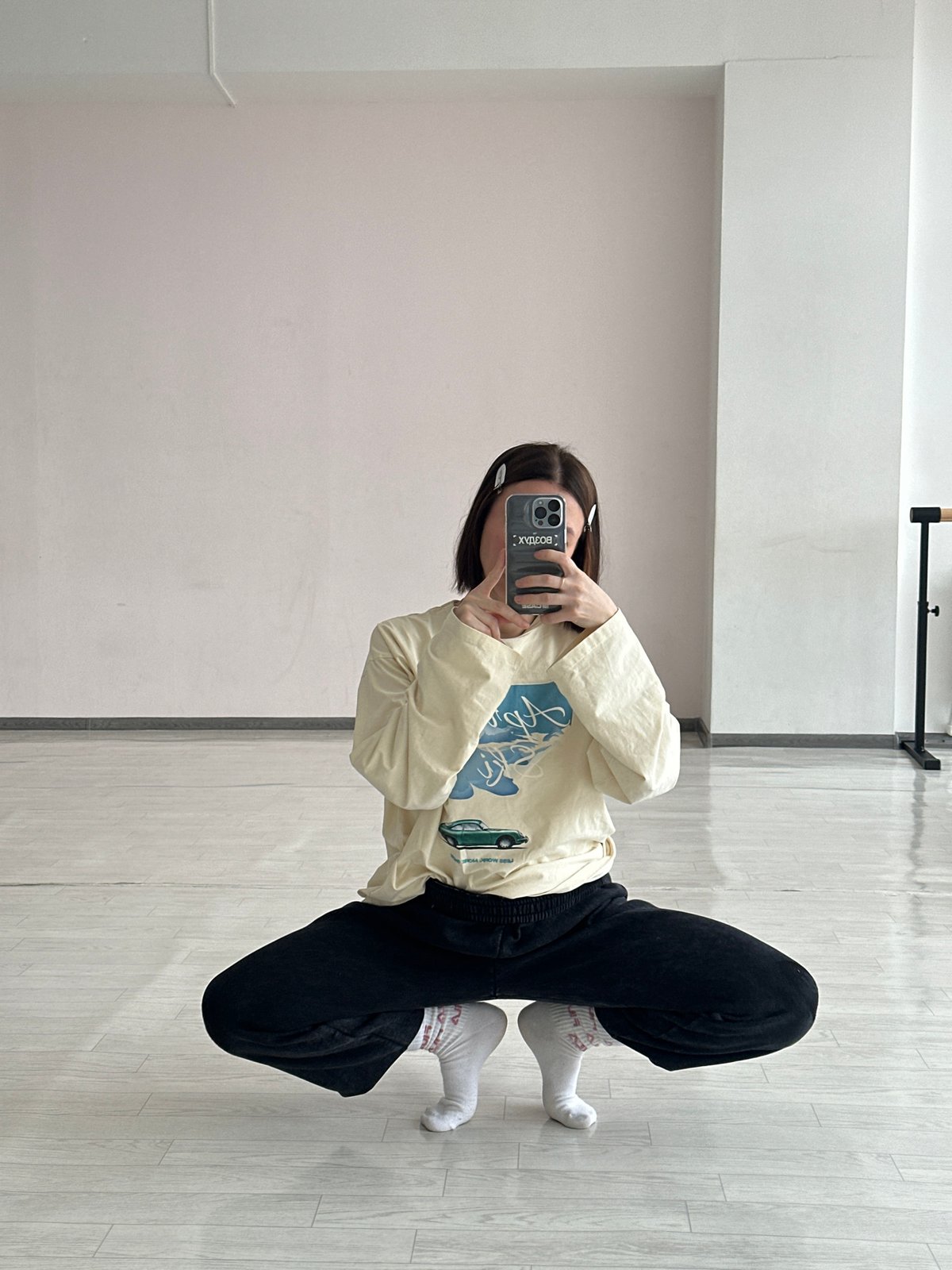 Woman takes selfies in indoor space in Votkinsk