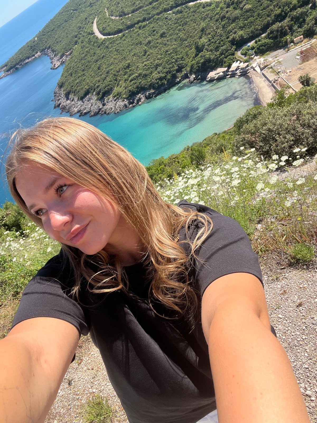 Tourists capture scenic Adriatic coast views near Višnjevo, Montenegro