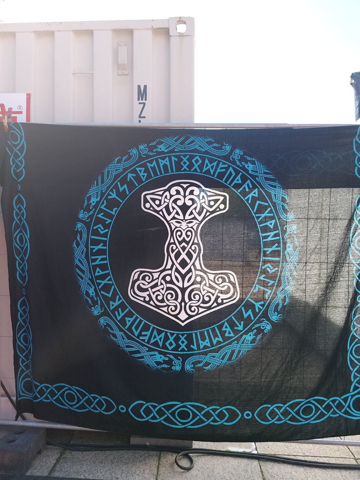 Outdoor art display features mythology banners and classical sculptures