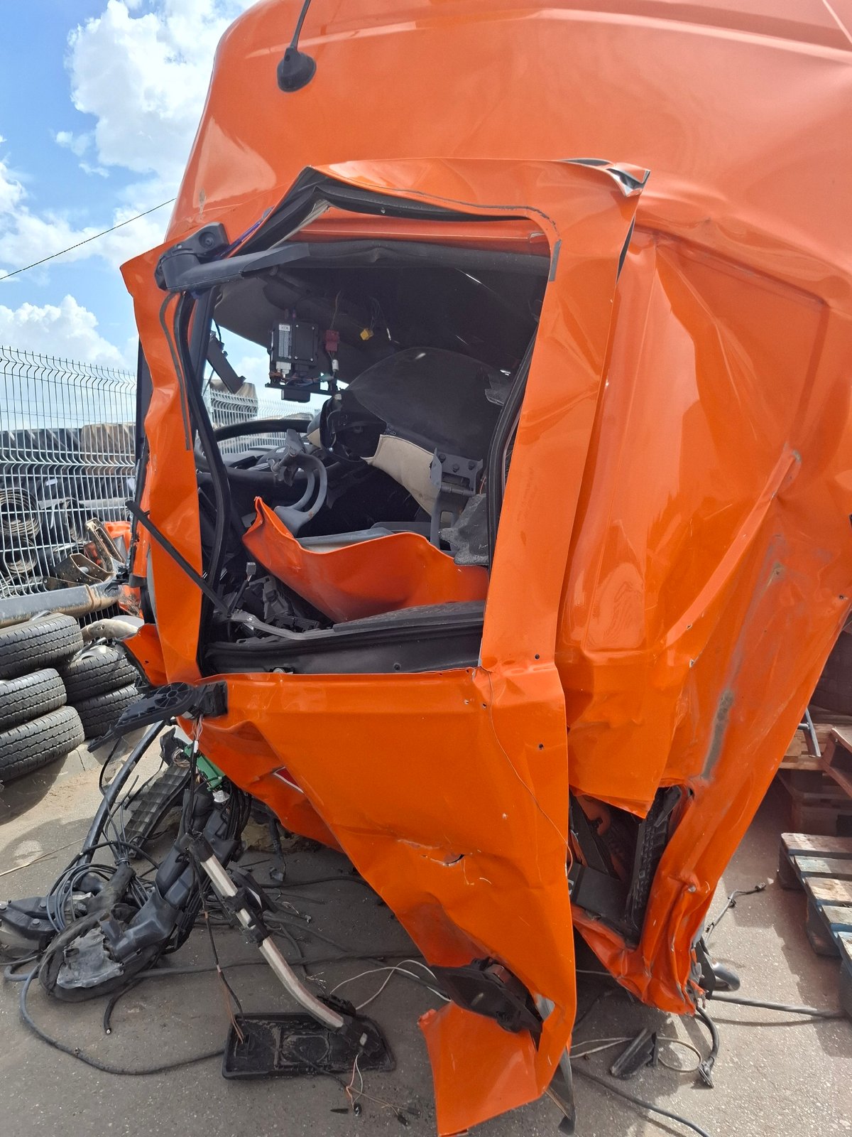 Truck depot maintenance and damaged vehicle documented in Izhevsk