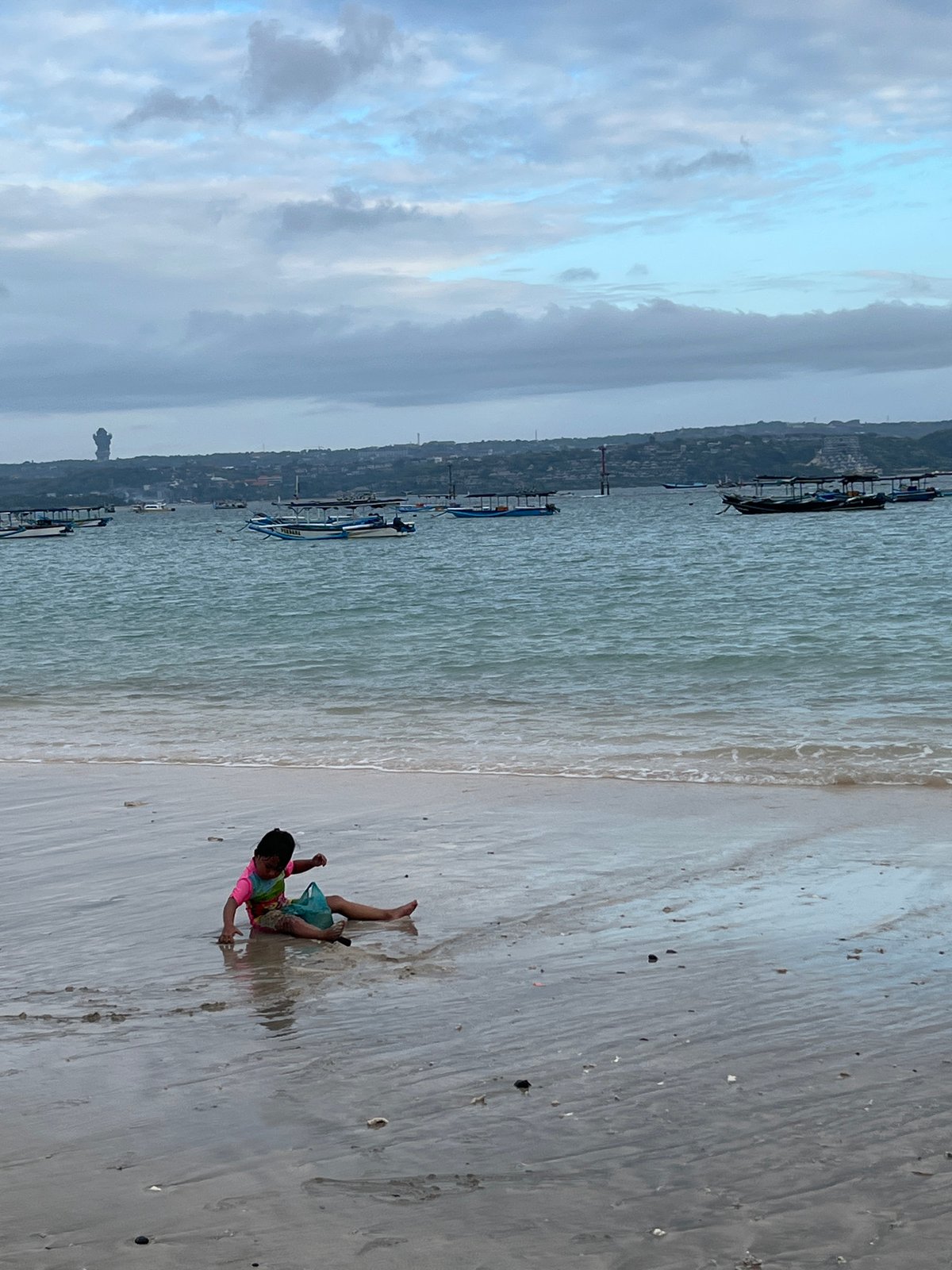 Kuta Beach morning: camel rides, shoreline play, and coastal tourism