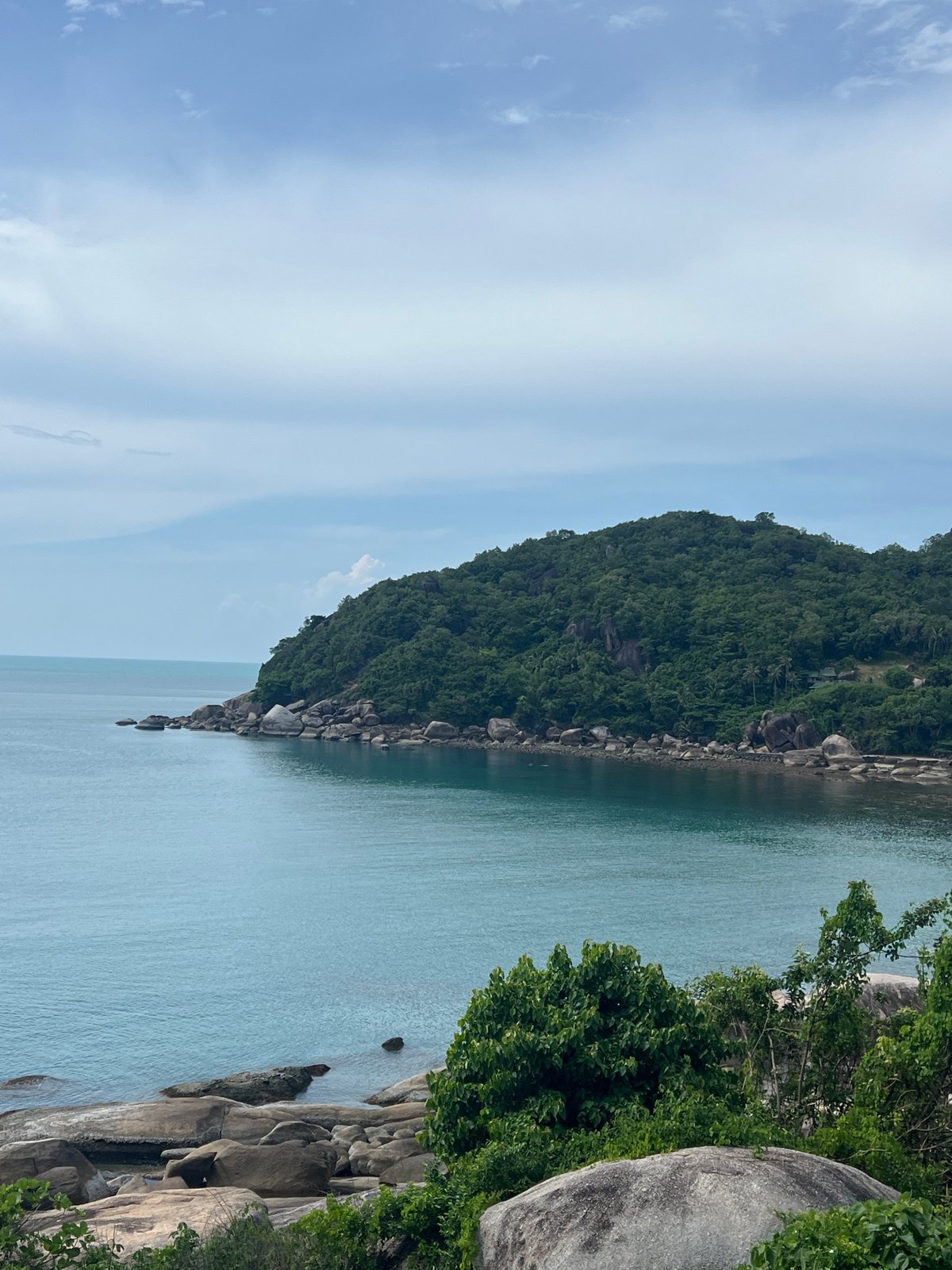 Granite boulders and turquoise water along Baan Chaweng Noi's rocky coast
