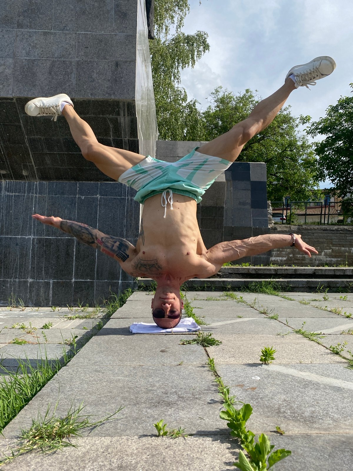 Man exercises near monuments in Pleven, Bulgaria afternoon session