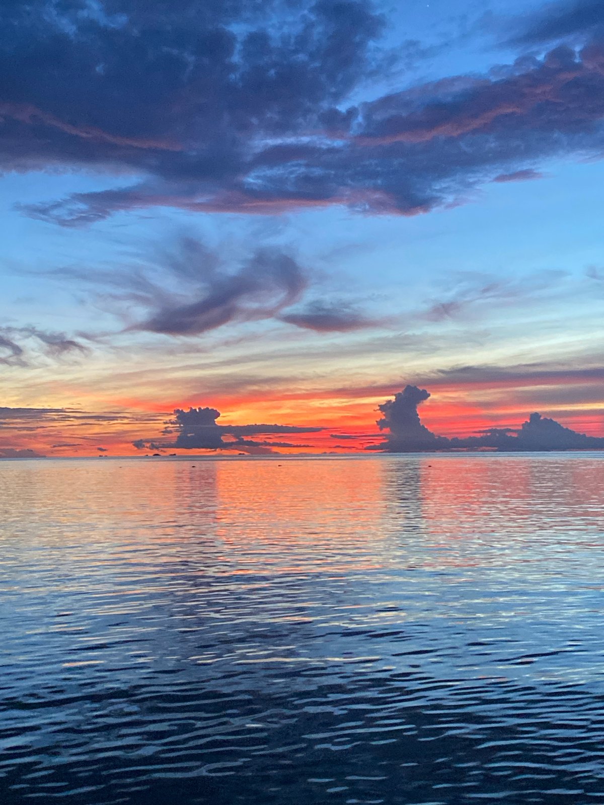 Vivid ocean sunset over Koh Phangan, caught from multiple angles