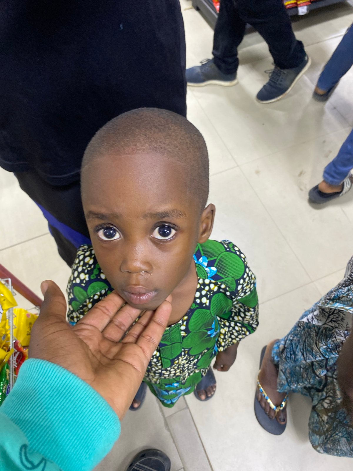Child browses snack aisle in Lagos supermarket