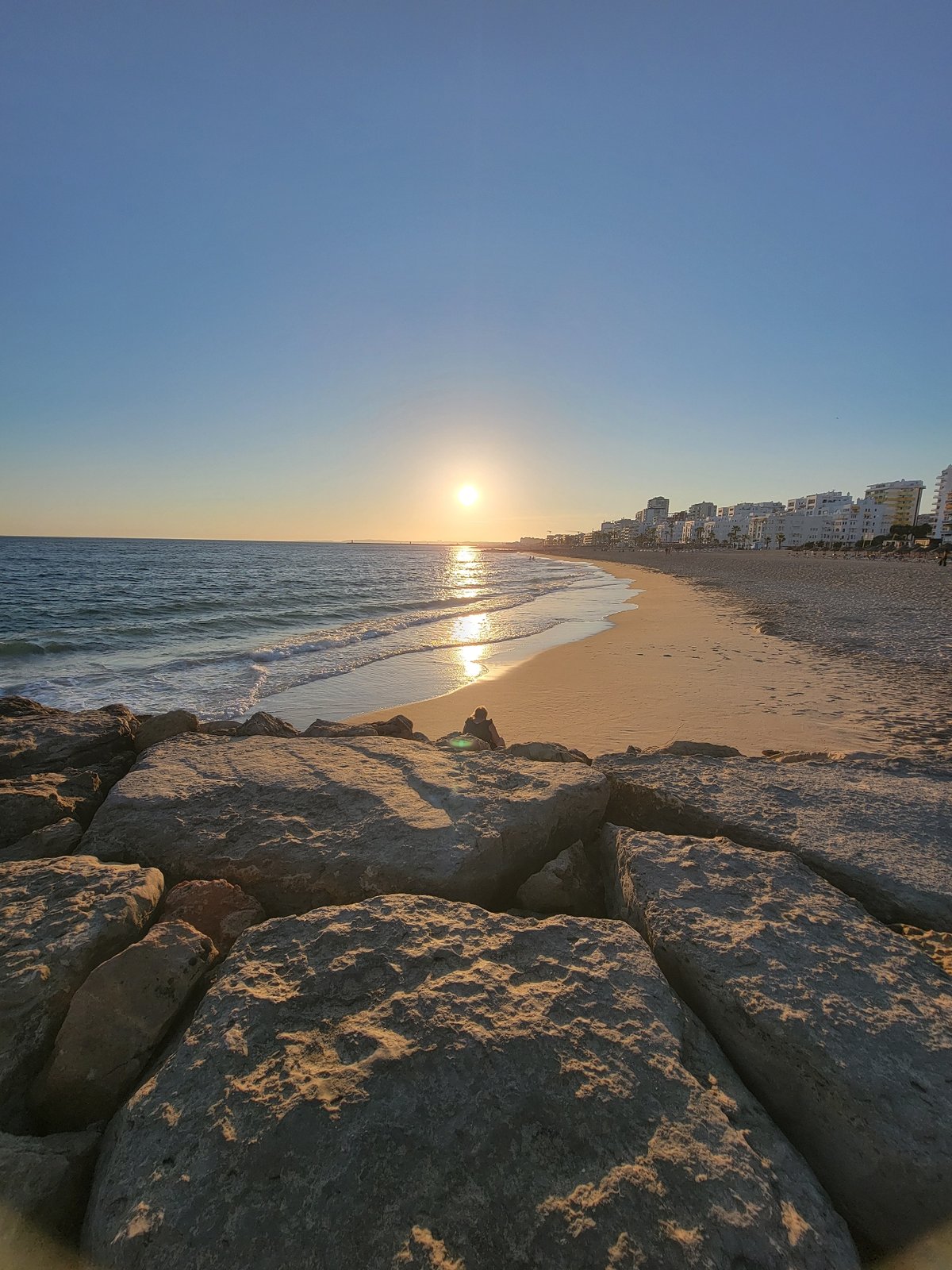 Golden hour on Quarteira beach, Portugal