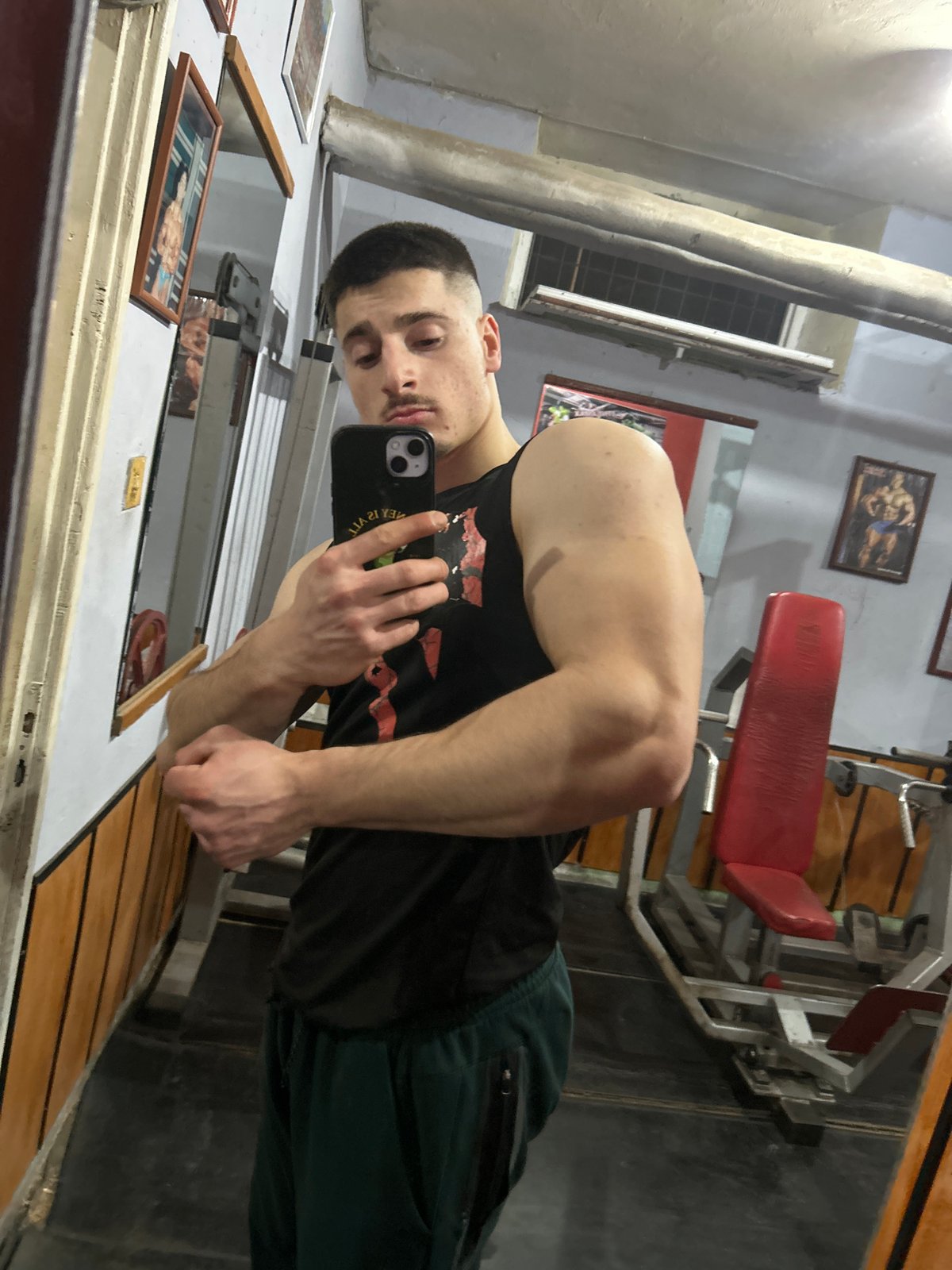 Person Takes Gym Selfies During Evening Workout Session