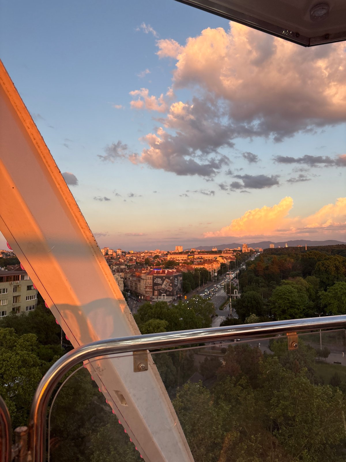 Ferris wheel sunset ride documented over Sofia Bulgaria
