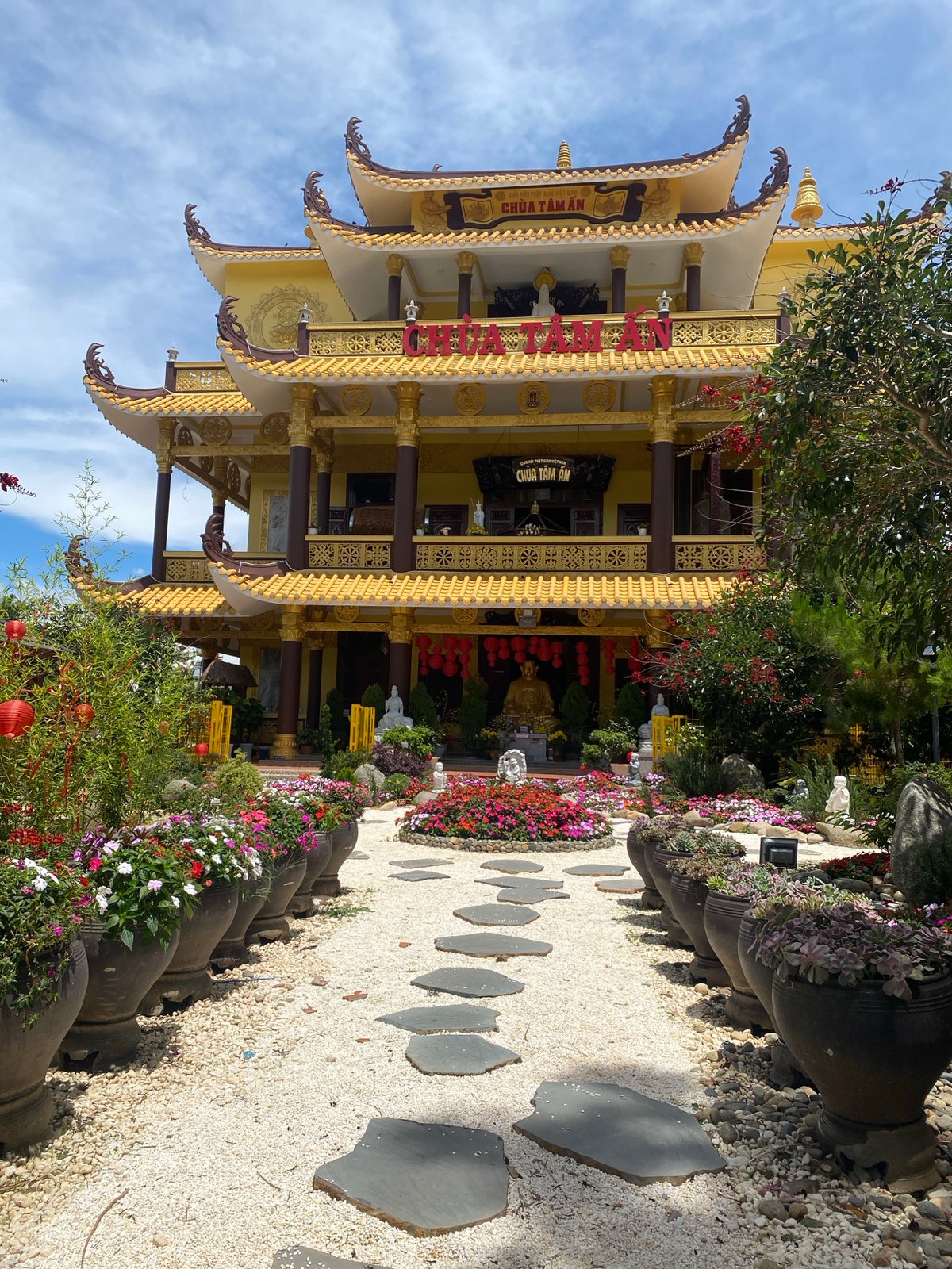 Buddhist temple with golden facade documented in Da Lat