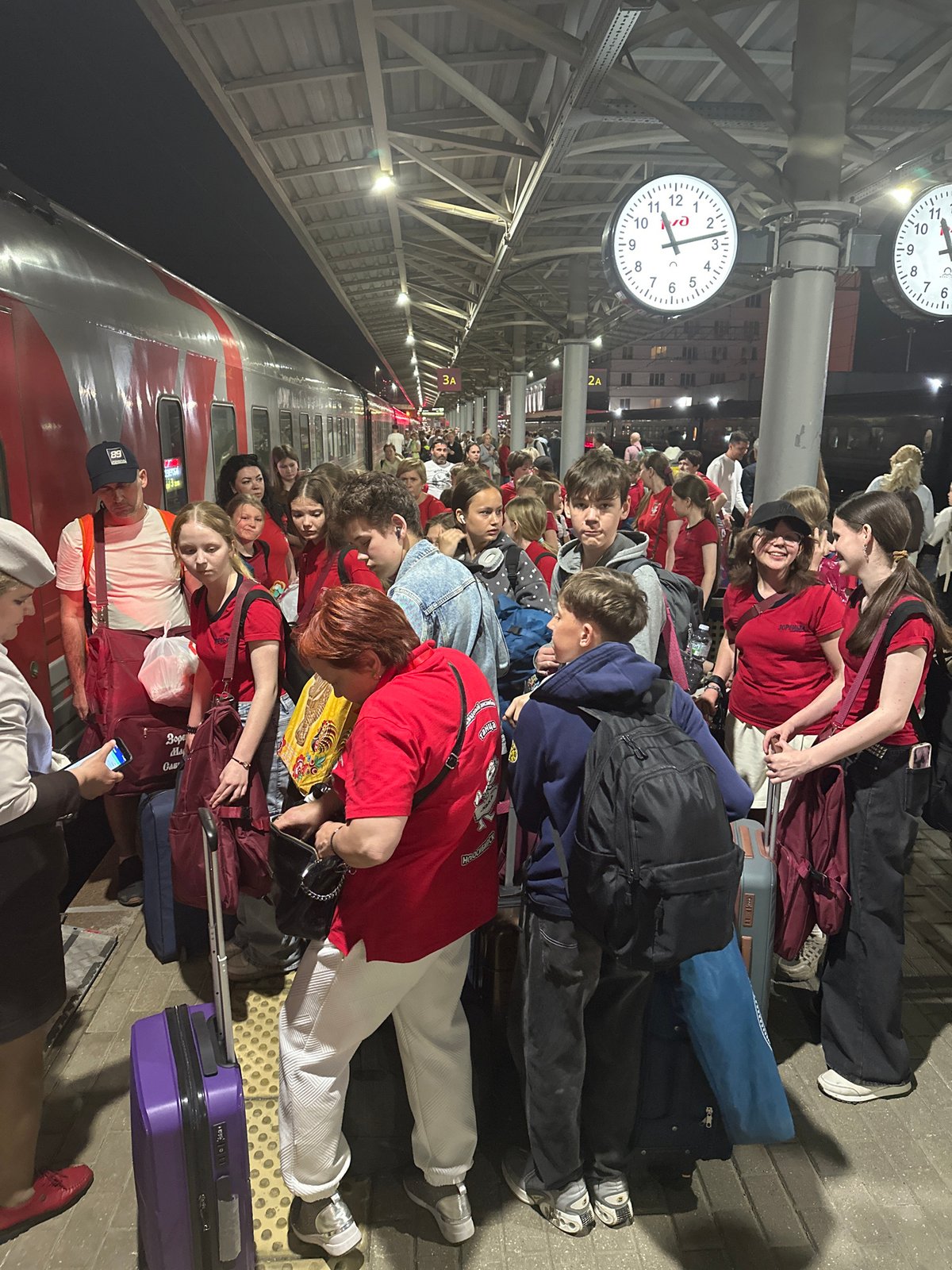 Youth group in red shirts gather at Nizhny Novgorod station