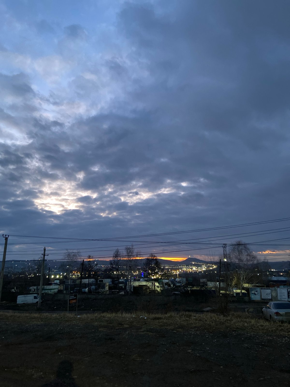 Evening drive documented through Krasnoyarsk streets during twilight hours