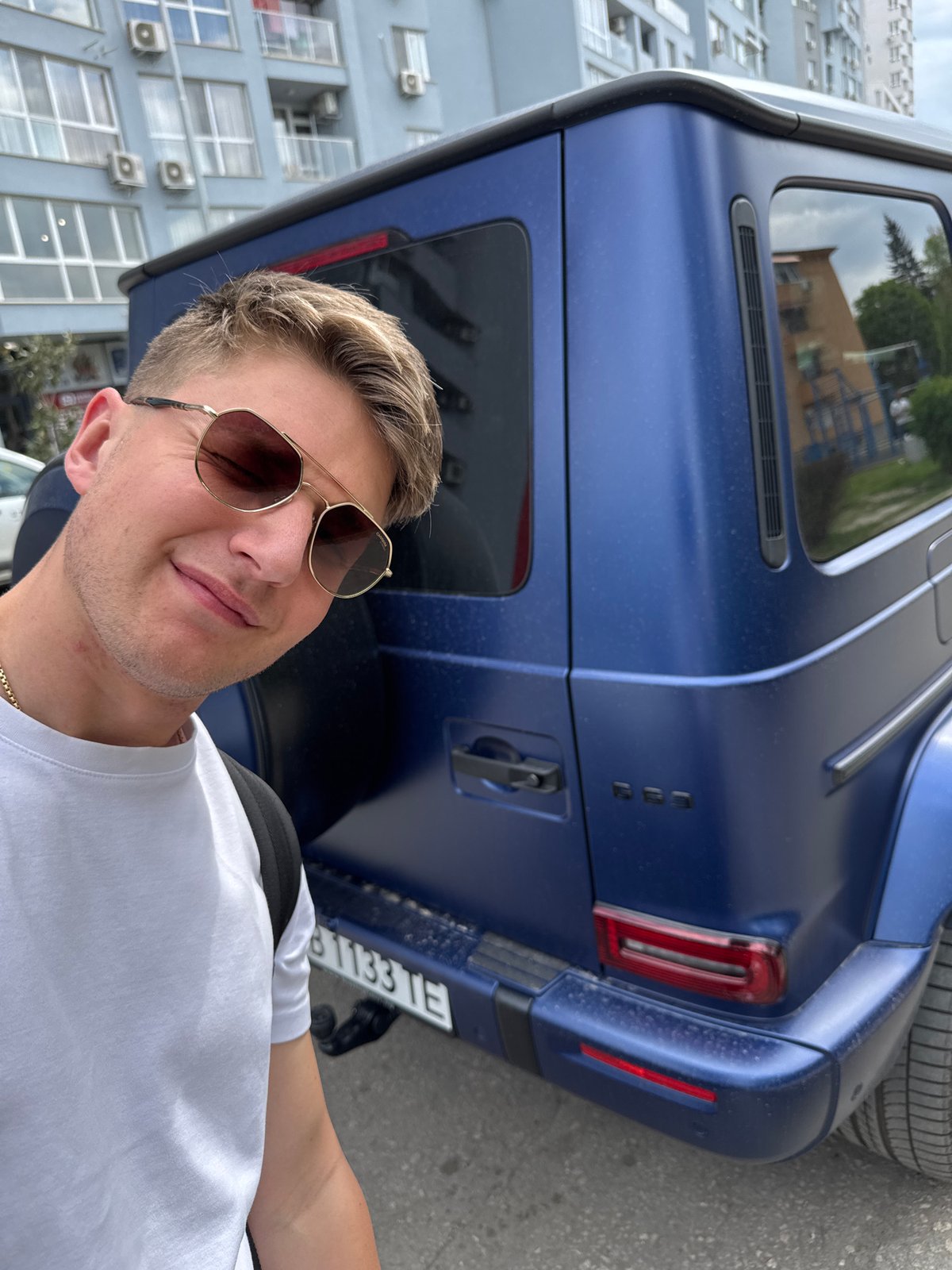 Young man poses with luxury SUV in Plovdiv