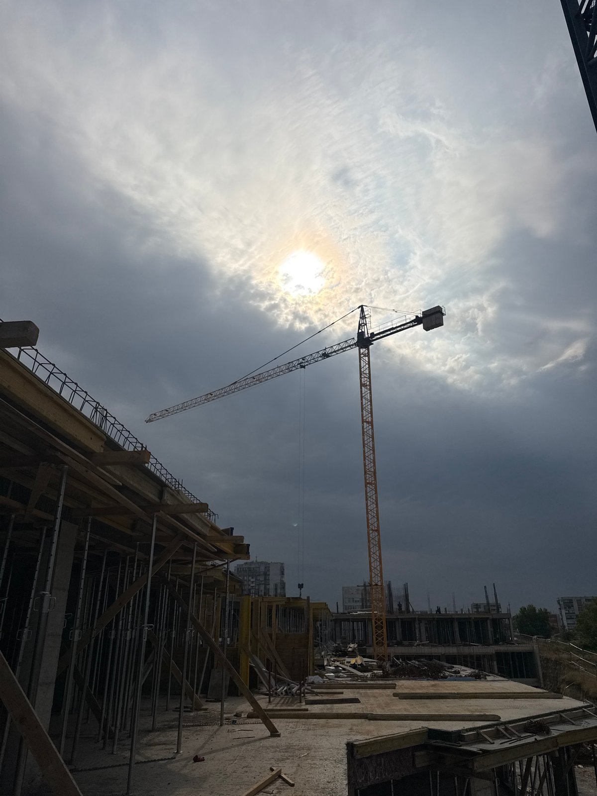 Active construction site in Varna with crane and excavator at work