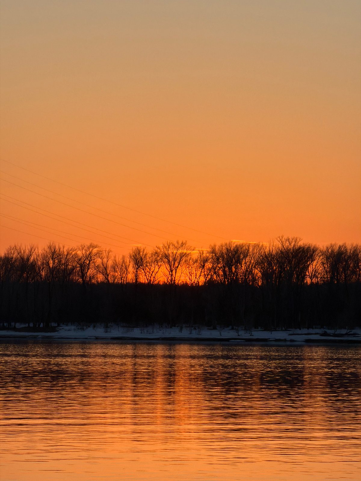 Winter fishing and sunset captured along Kama River, Chaikovsky