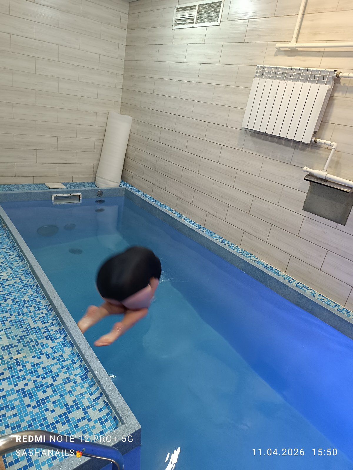 Indoor pool activities and outdoor food preparation in Chaikovsky