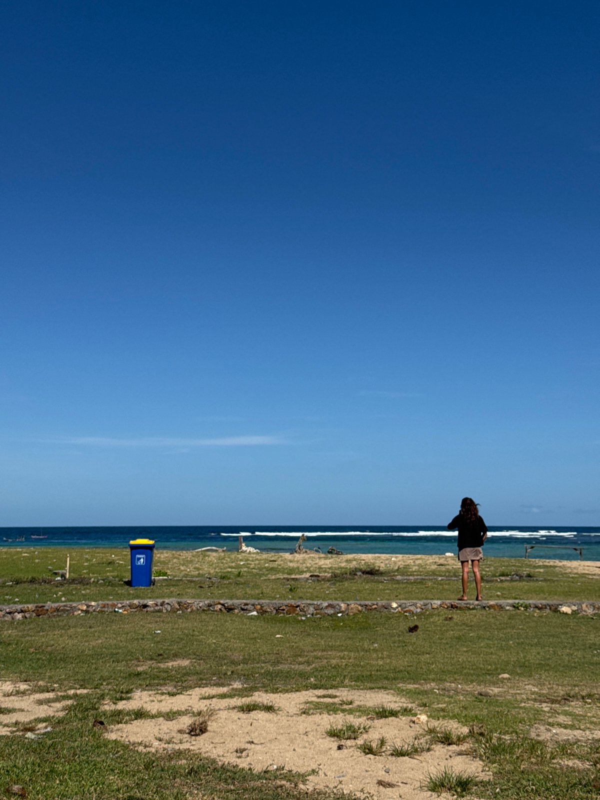Morning beach activity captured in Kuta, Indonesia